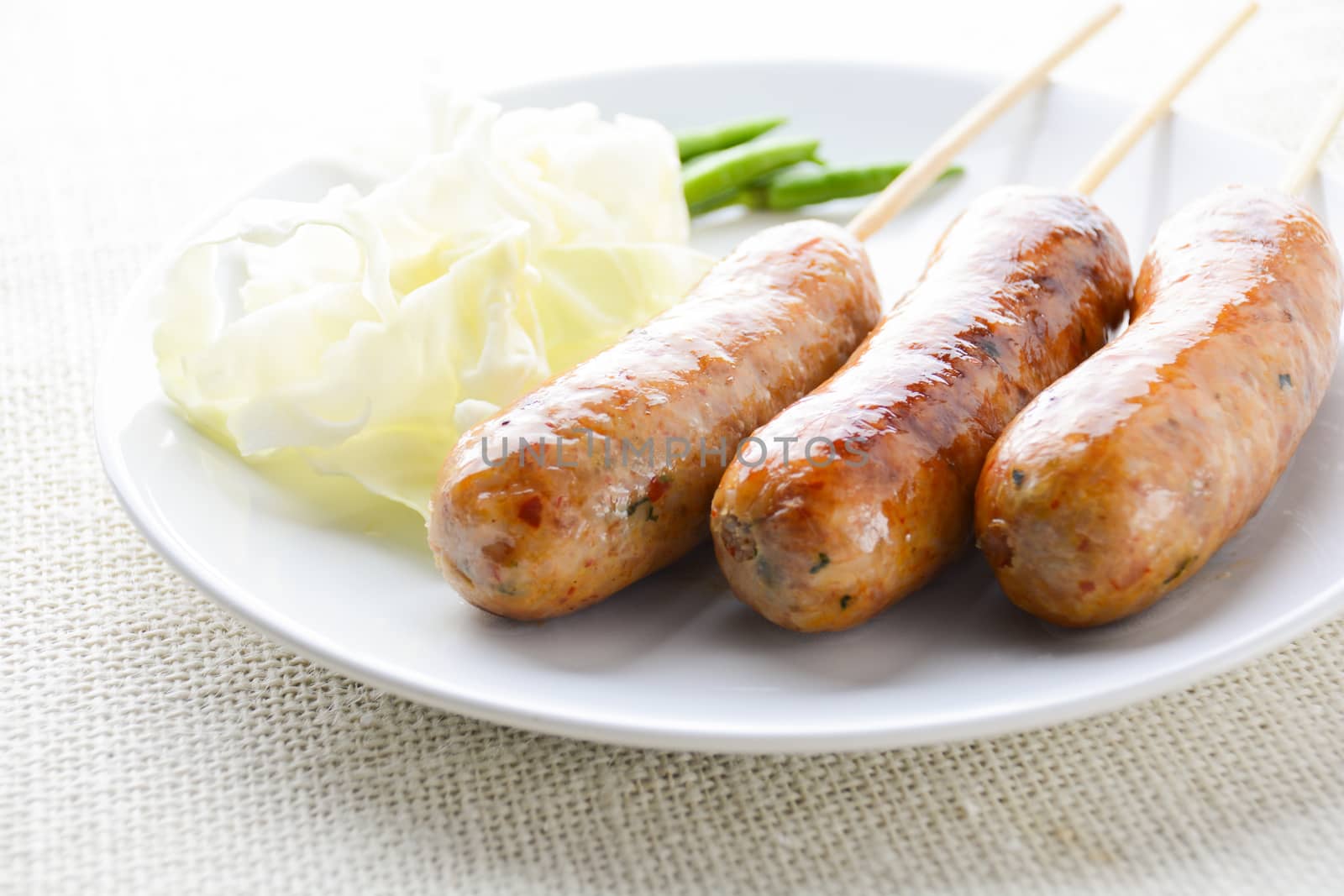 Thai Spicy Sausages, made from minced pork mixed with a variety of ingredients which makes it packed with flavour, and gives it a unique scent.
