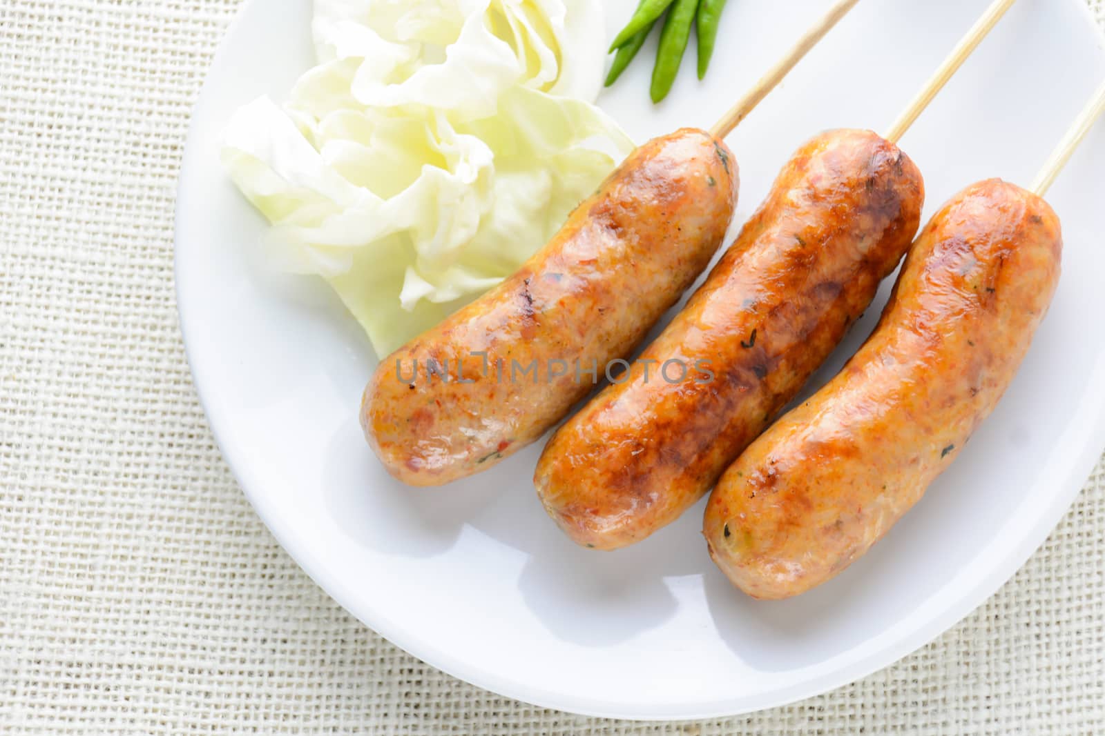 Thai Spicy Sausages, made from minced pork mixed with a variety  by yuiyuize