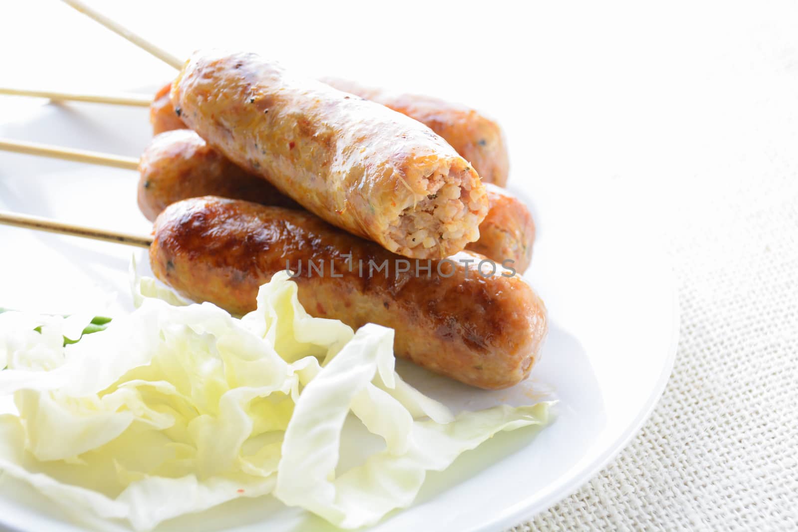 Thai Spicy Sausages, made from minced pork mixed with a variety  by yuiyuize