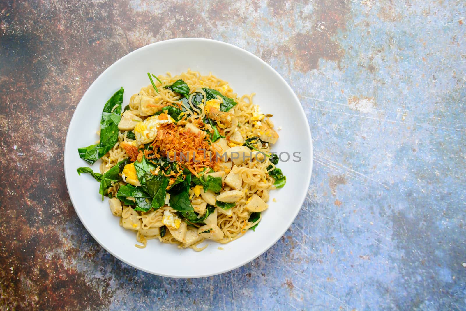 Fried noodles with Vietnamese Grilled Pork Sausage, eggs and Gnetum gnemon leaves
