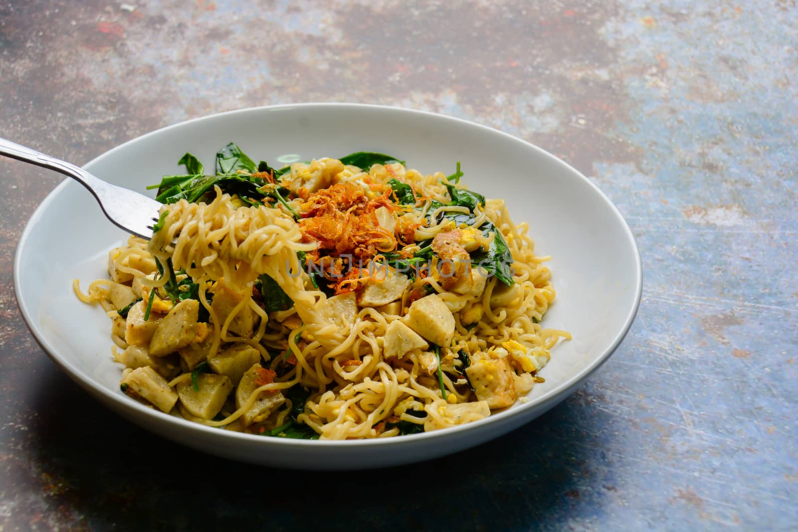 Fried noodles with Vietnamese Grilled Pork Sausage, eggs and Gnetum gnemon leaves
