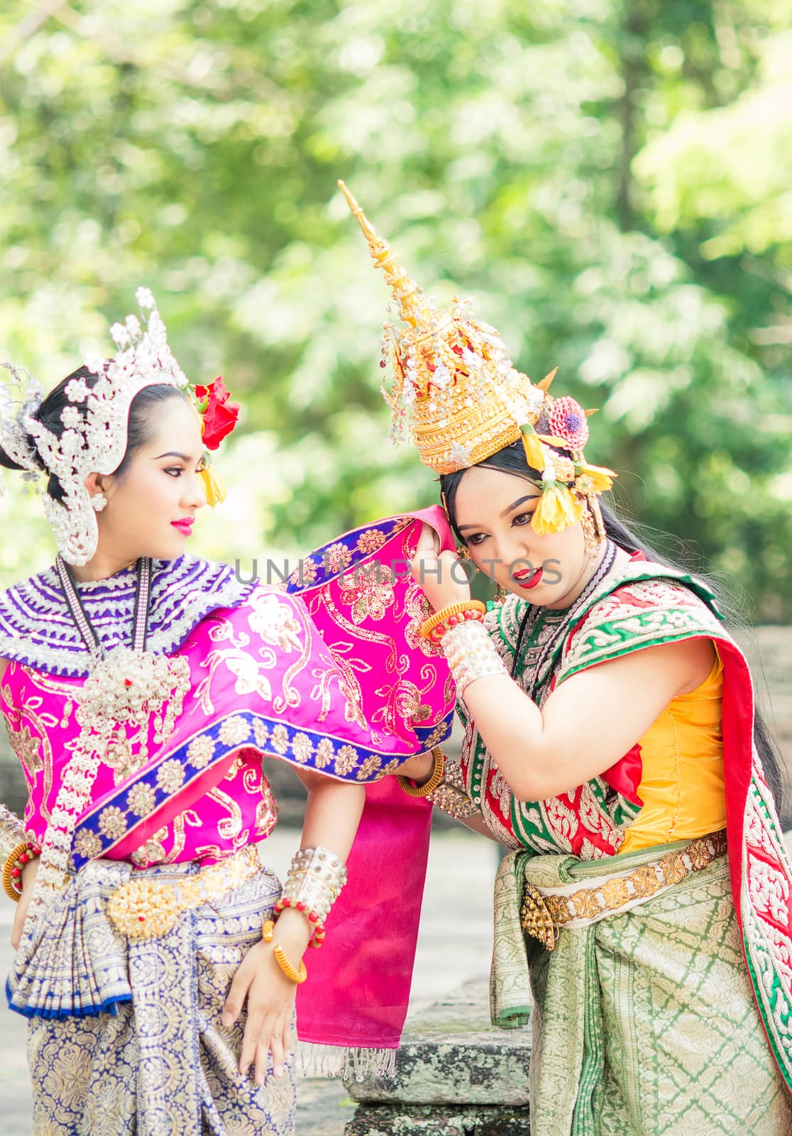 Asian woman wearing typical, traditional Thai Dress. It is liter by yuiyuize
