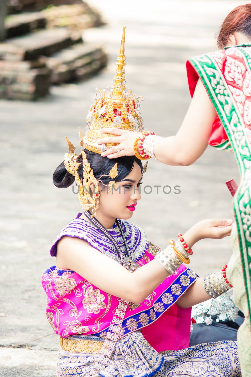 Asian woman wearing typical, traditional Thai Dress. It is liter by yuiyuize