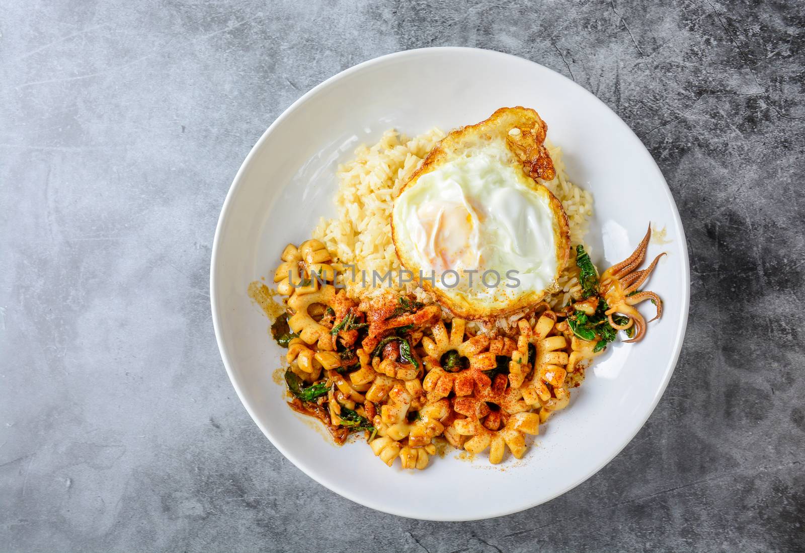 Spicy stir fried squid with basil leaves and chili, Sunny side u by yuiyuize