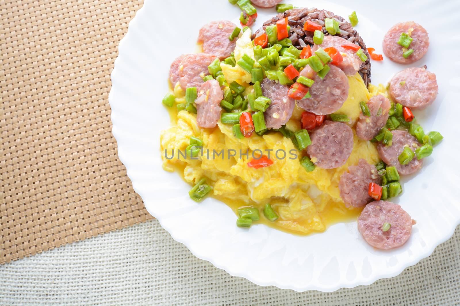 Fermented Pork Sausage Omelet with eggs and chilies, this dish would be delicious by fried in large amount of hot oil.