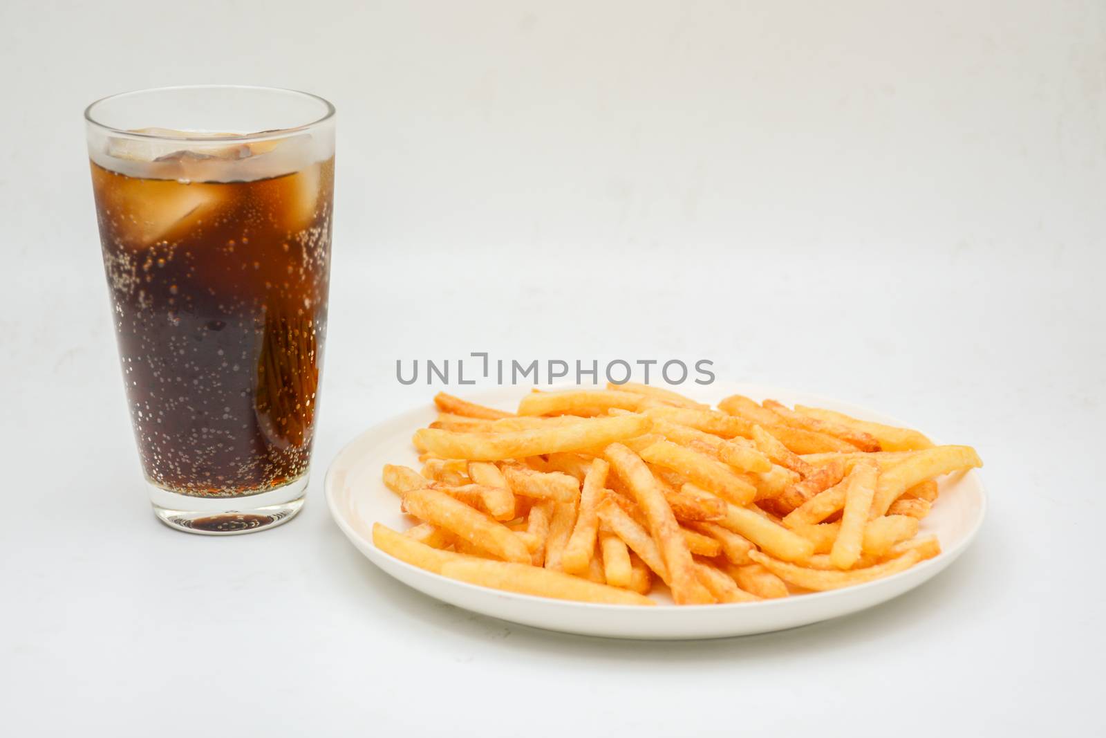 French fries on white dish and white background. by yuiyuize