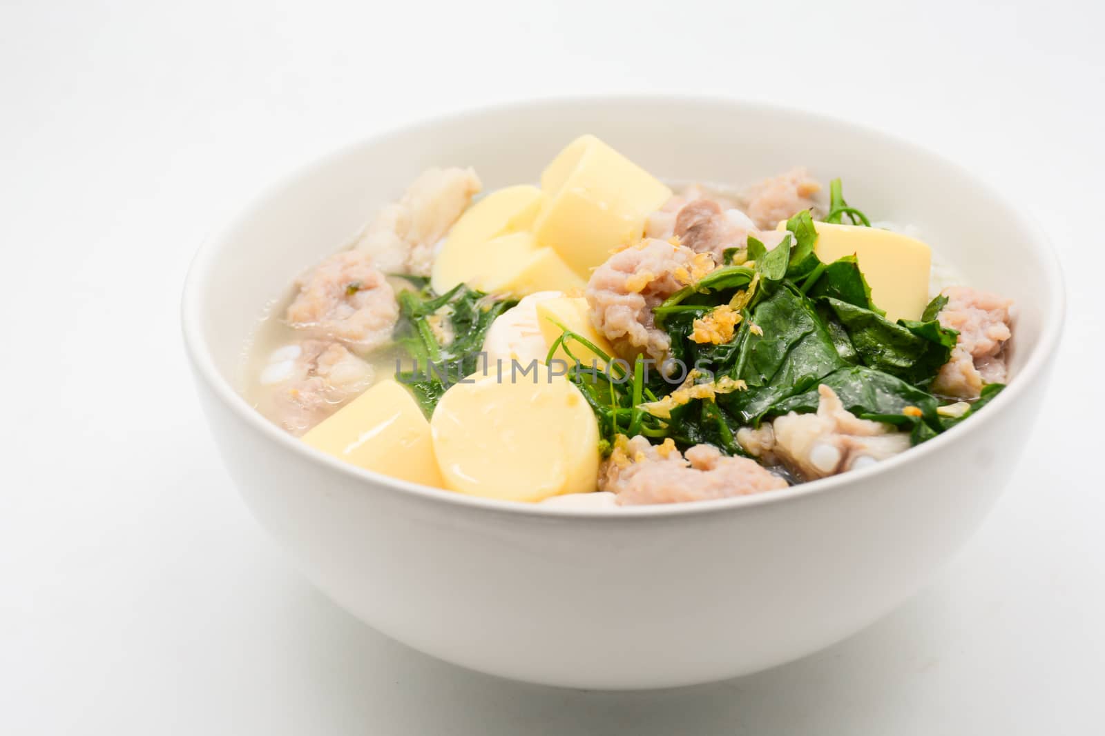 Boiled rice with pork, ivy gourd leaves and soft tofu