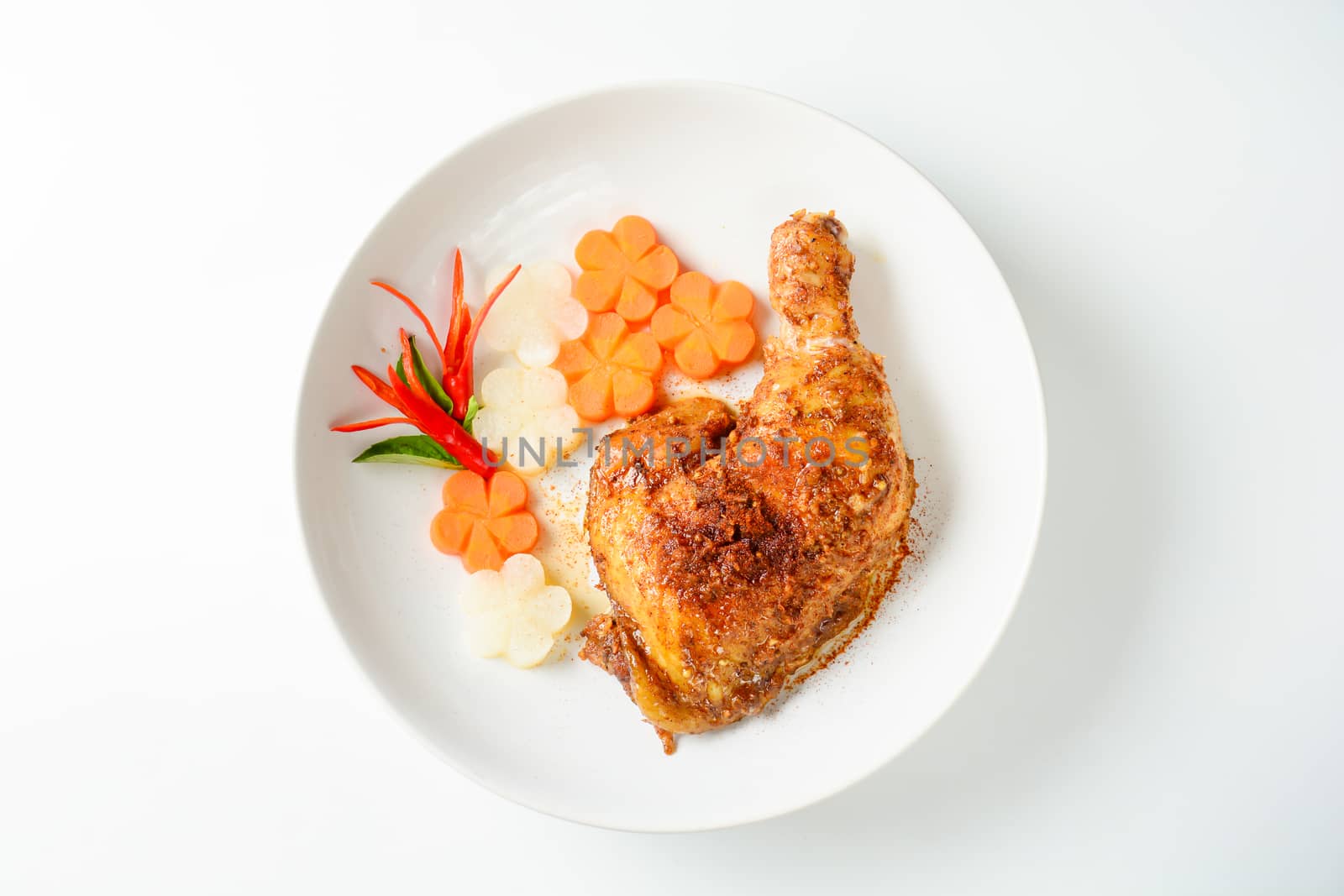 Hot and spicy baked chicken on white plate by yuiyuize