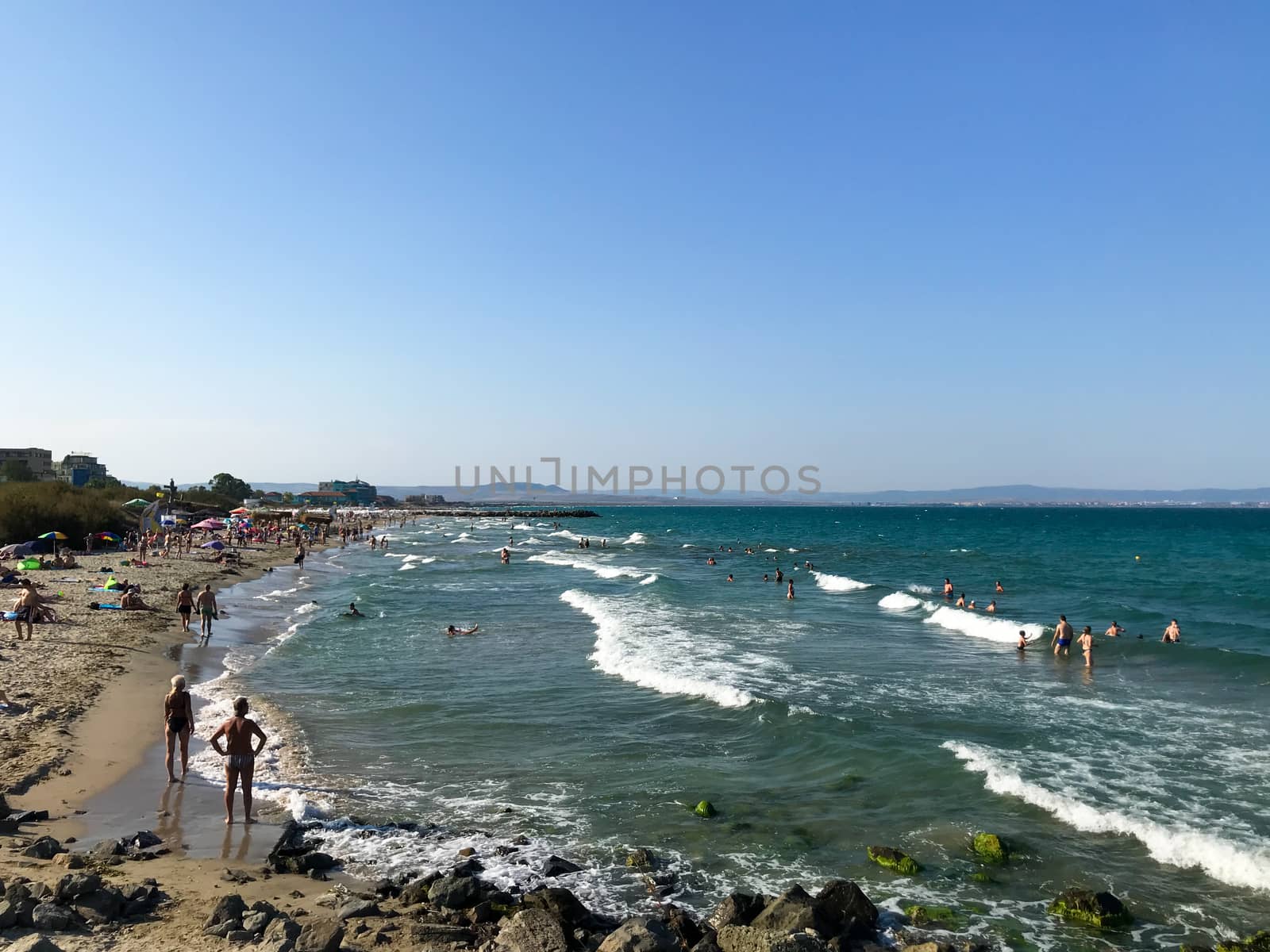 Pomorie, Bulgaria - September 01, 2019: People Relaxing On The Beach. by nenovbrothers