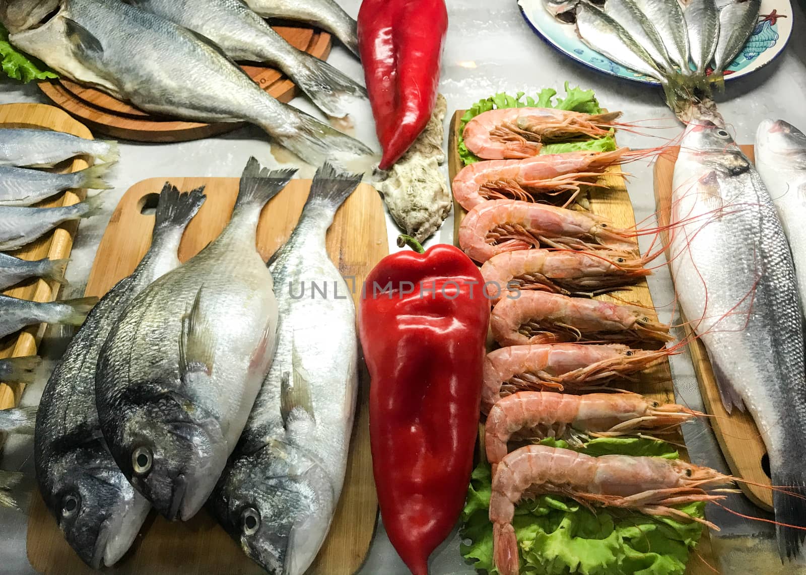 Fresh Fish And Seafood Exposed For Sale In The Fish Market by nenovbrothers