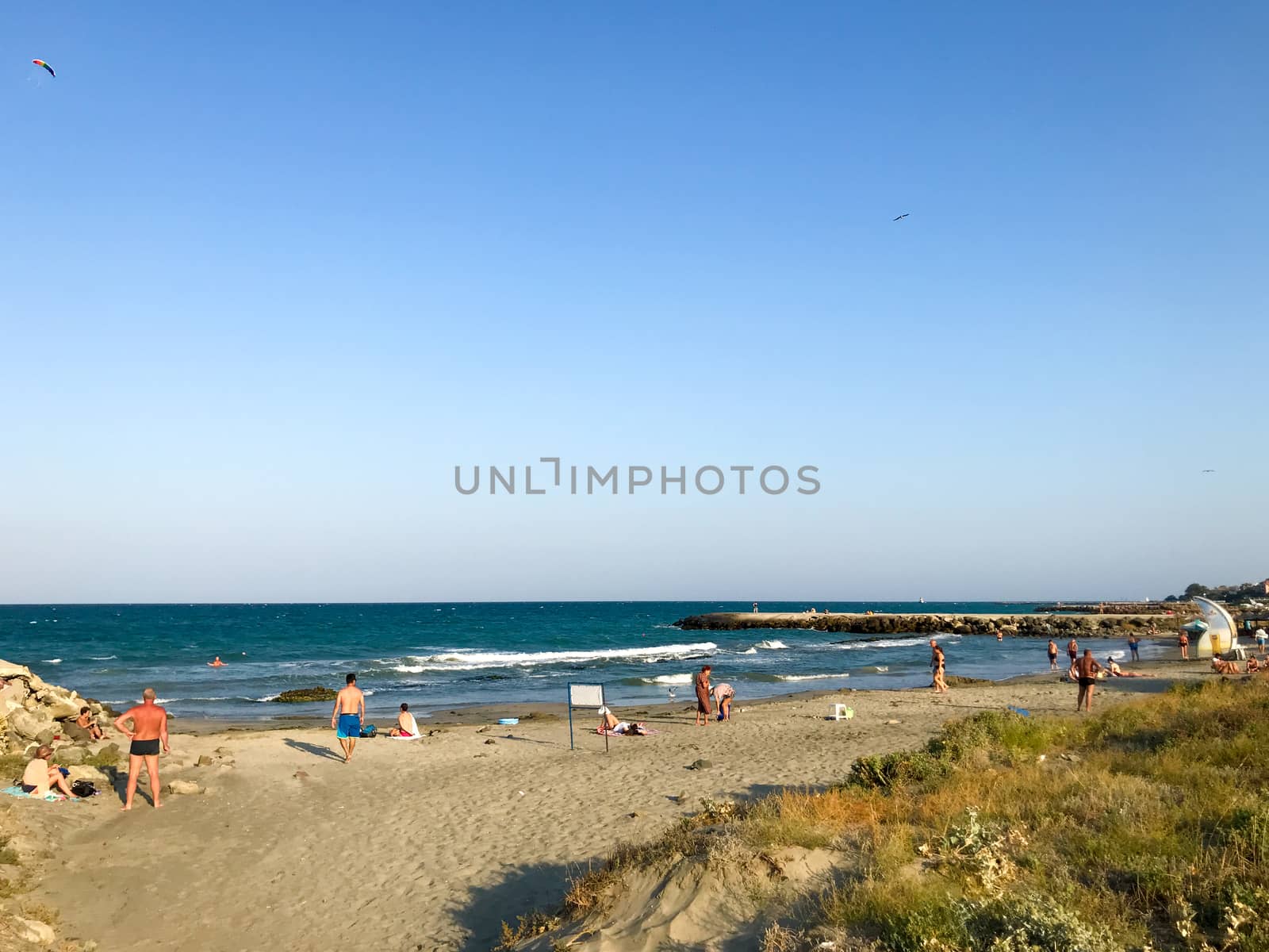 Pomorie, Bulgaria - September 01, 2019: People Relaxing On The Beach. by nenovbrothers