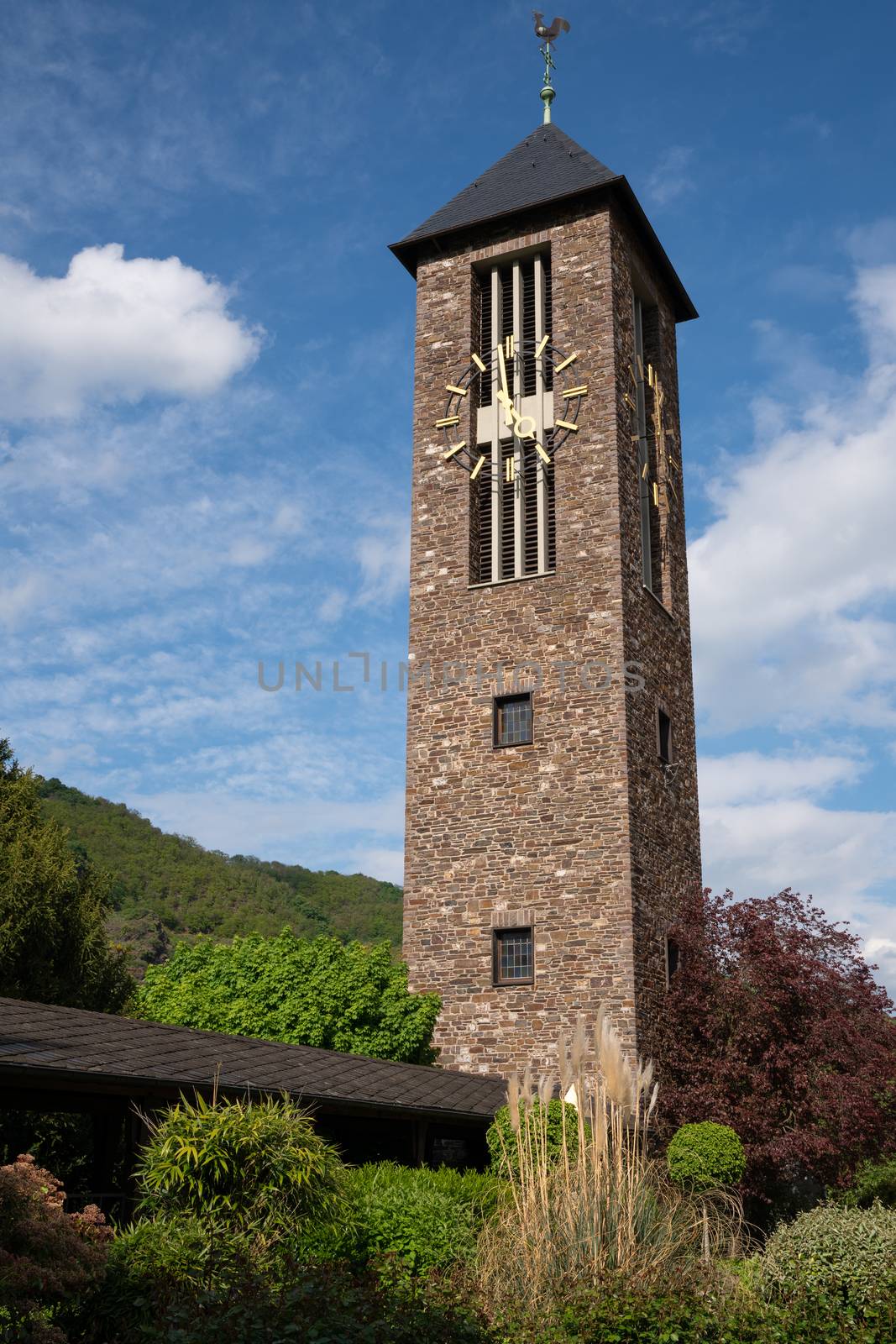 Bell tower of monastery Ebernach with blue sky, Cochem, Germany