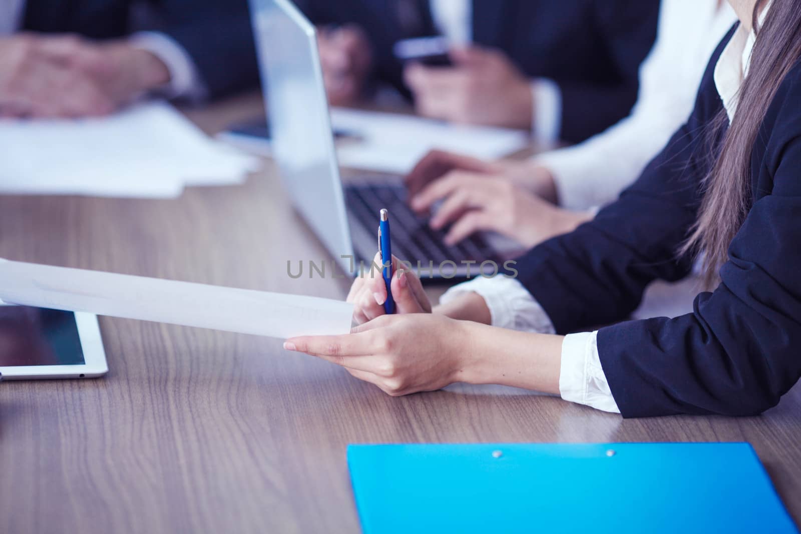 Close-up of Business people working together at meeting