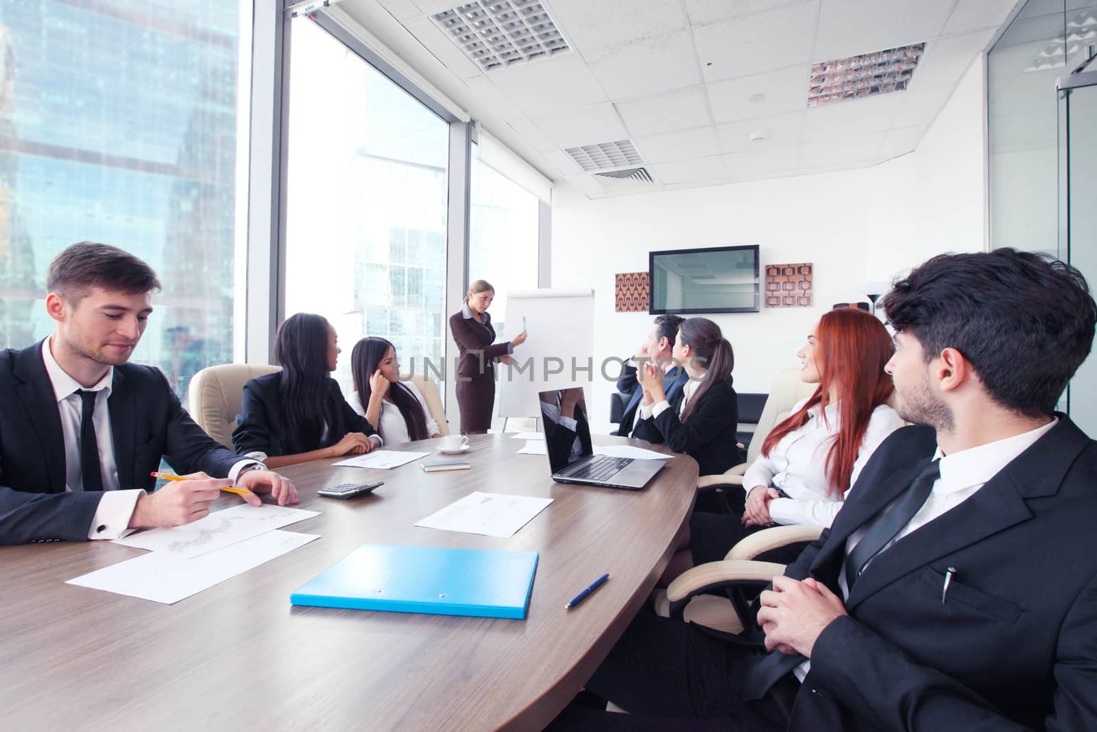 Business presntation on meeting of diverse people around the table