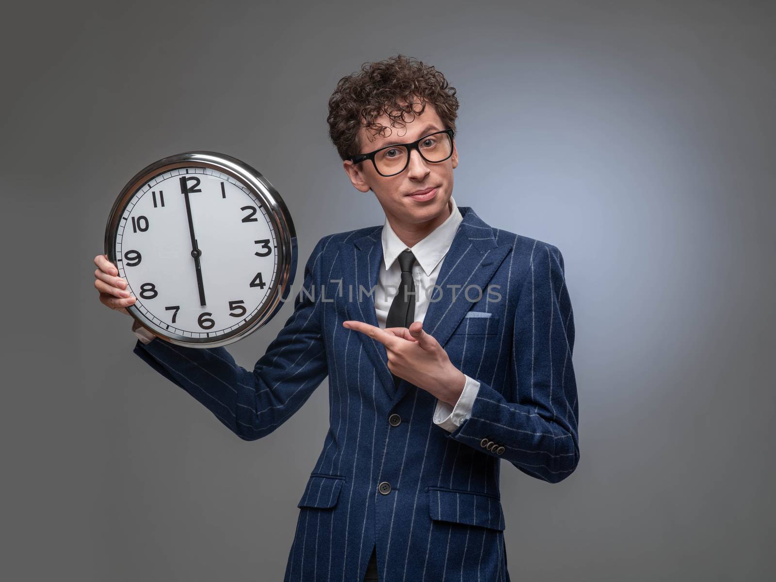 Businessman with wall clock by ALotOfPeople