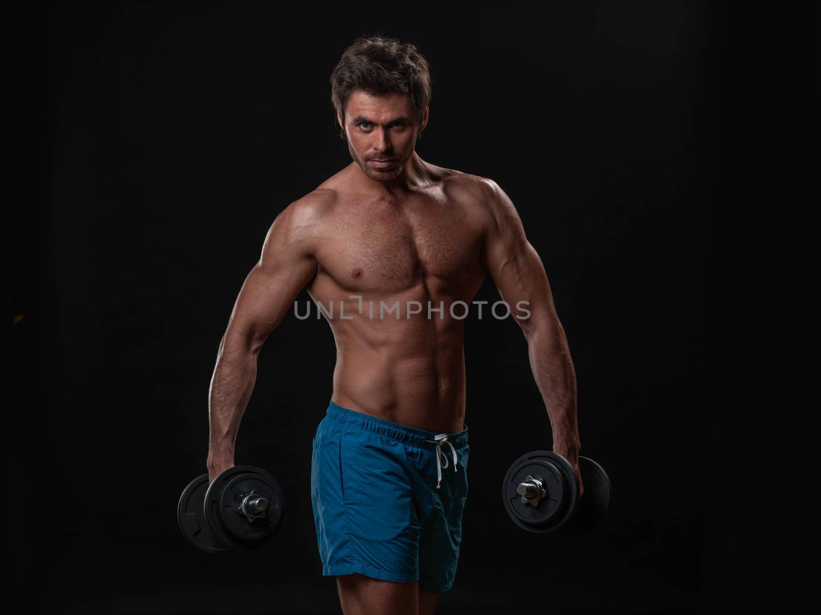 Muscular man lifting weights by ALotOfPeople