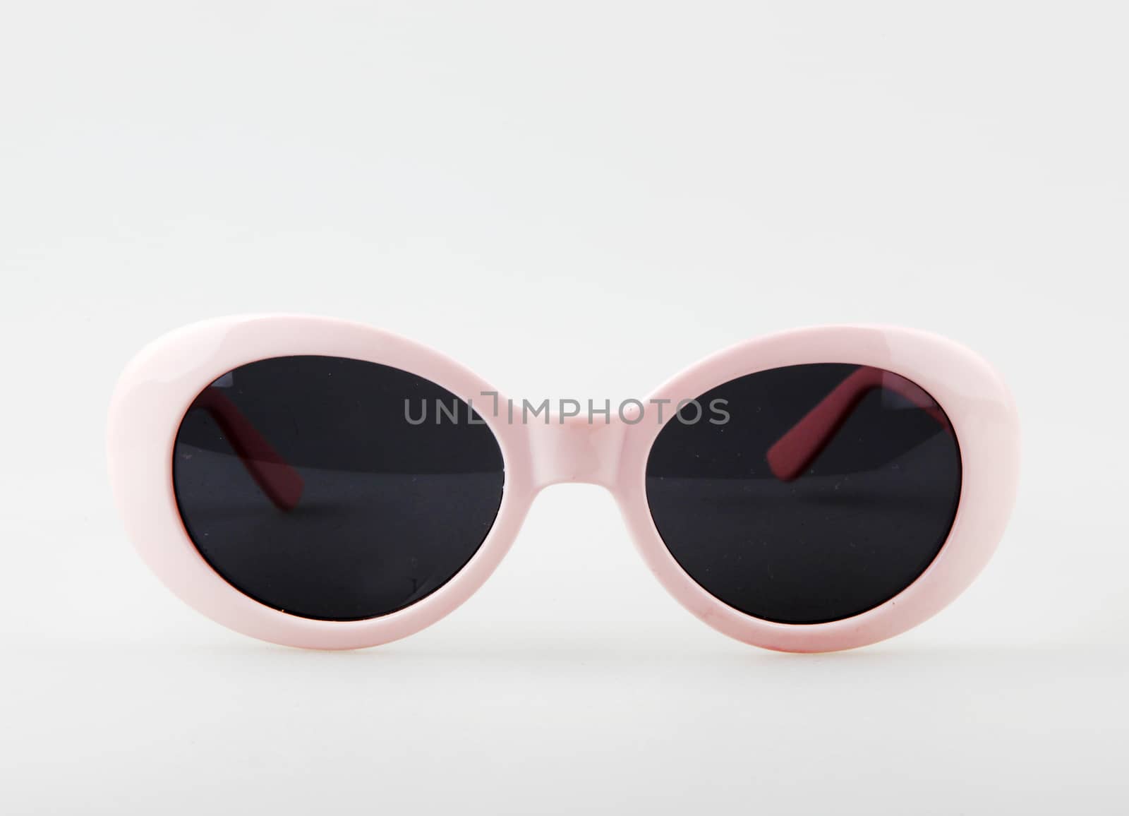 Women's Pink Sunglasses Against White Background by nenovbrothers