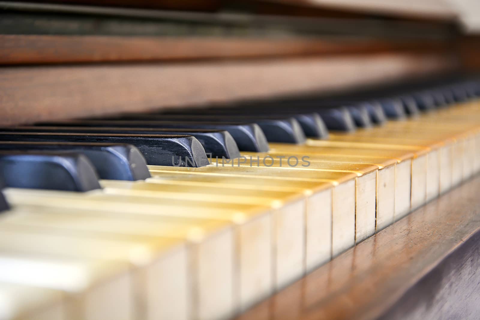 close-up view of the keys of a ancient ruined piano