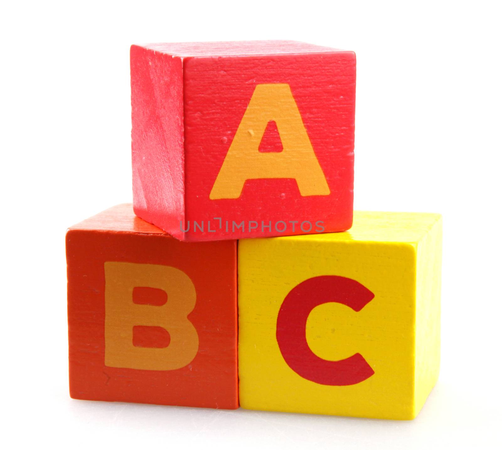 Wooden Alphabet Blocks Against White Background by nenovbrothers