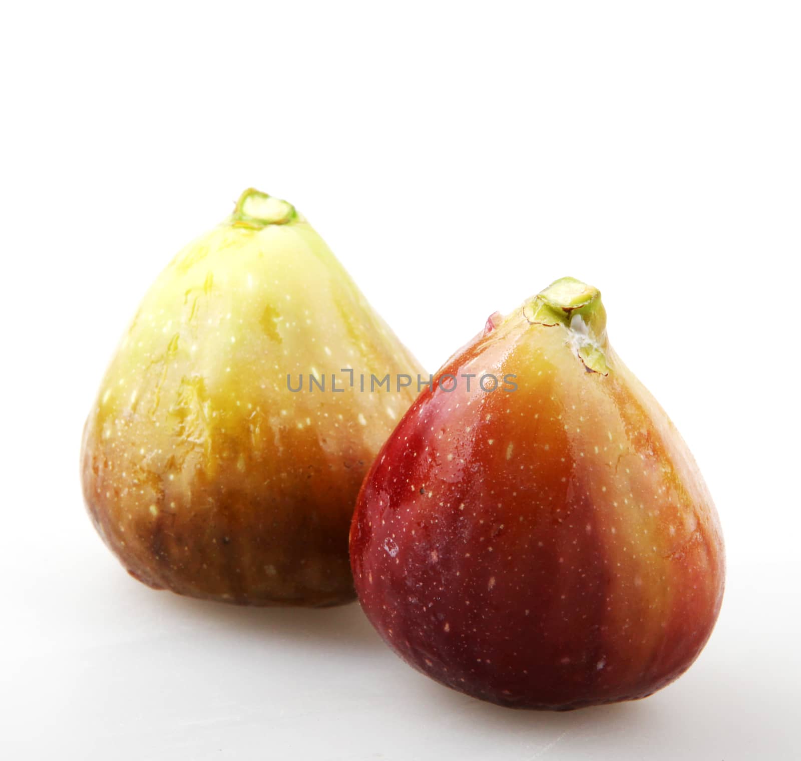 Close-Up Of Fig Against White Background 