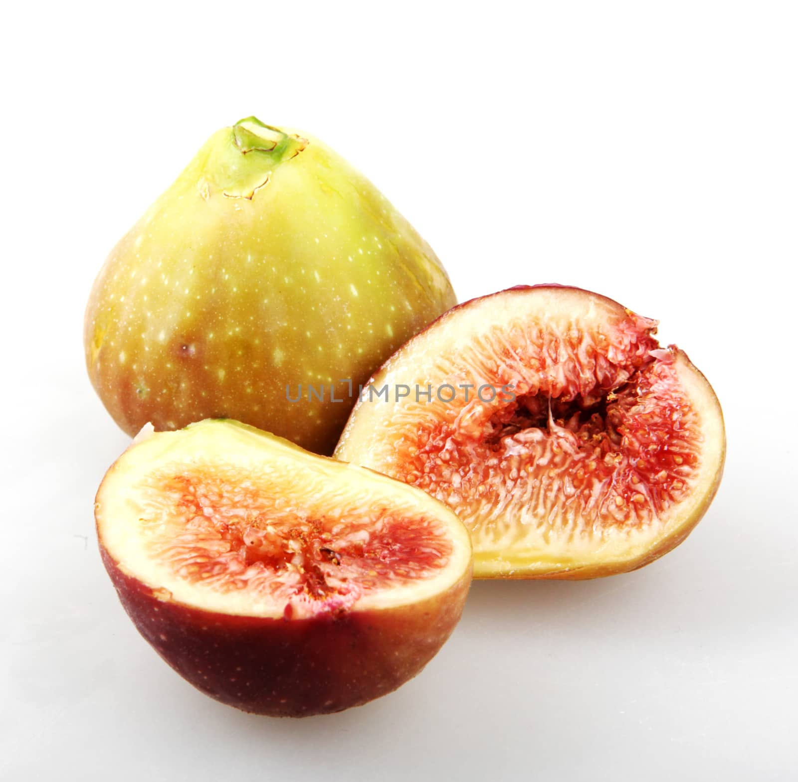 Close-Up Of Fig Against White Background  by nenovbrothers