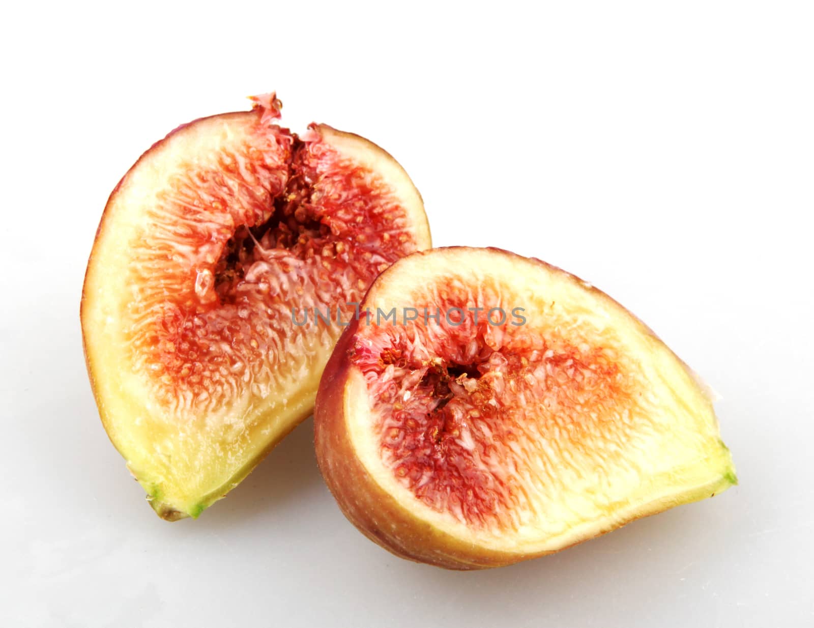 Close-Up Of Fig Against White Background  by nenovbrothers