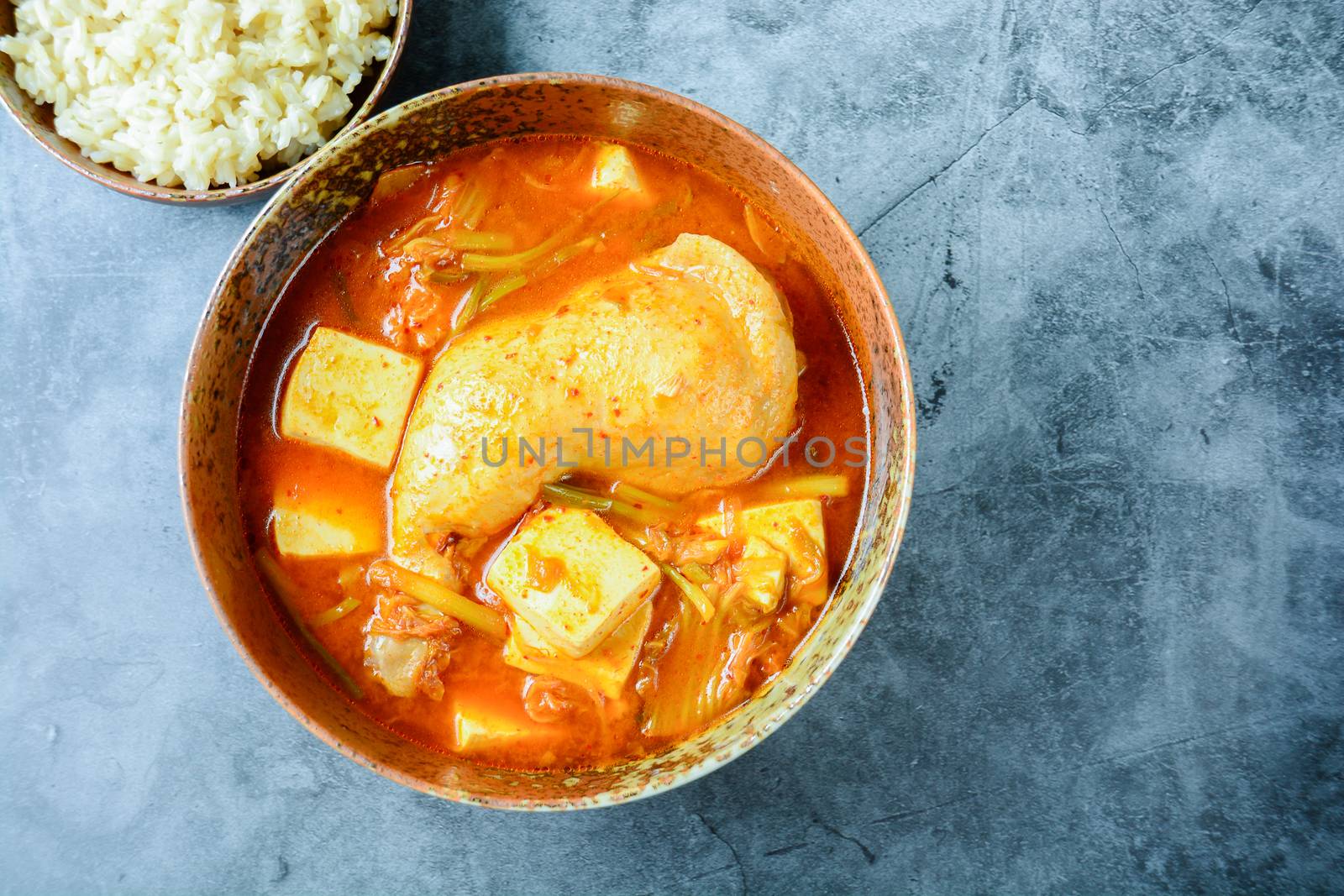 Korean traditional Kimchi soup with chicken and soft tofu by yuiyuize