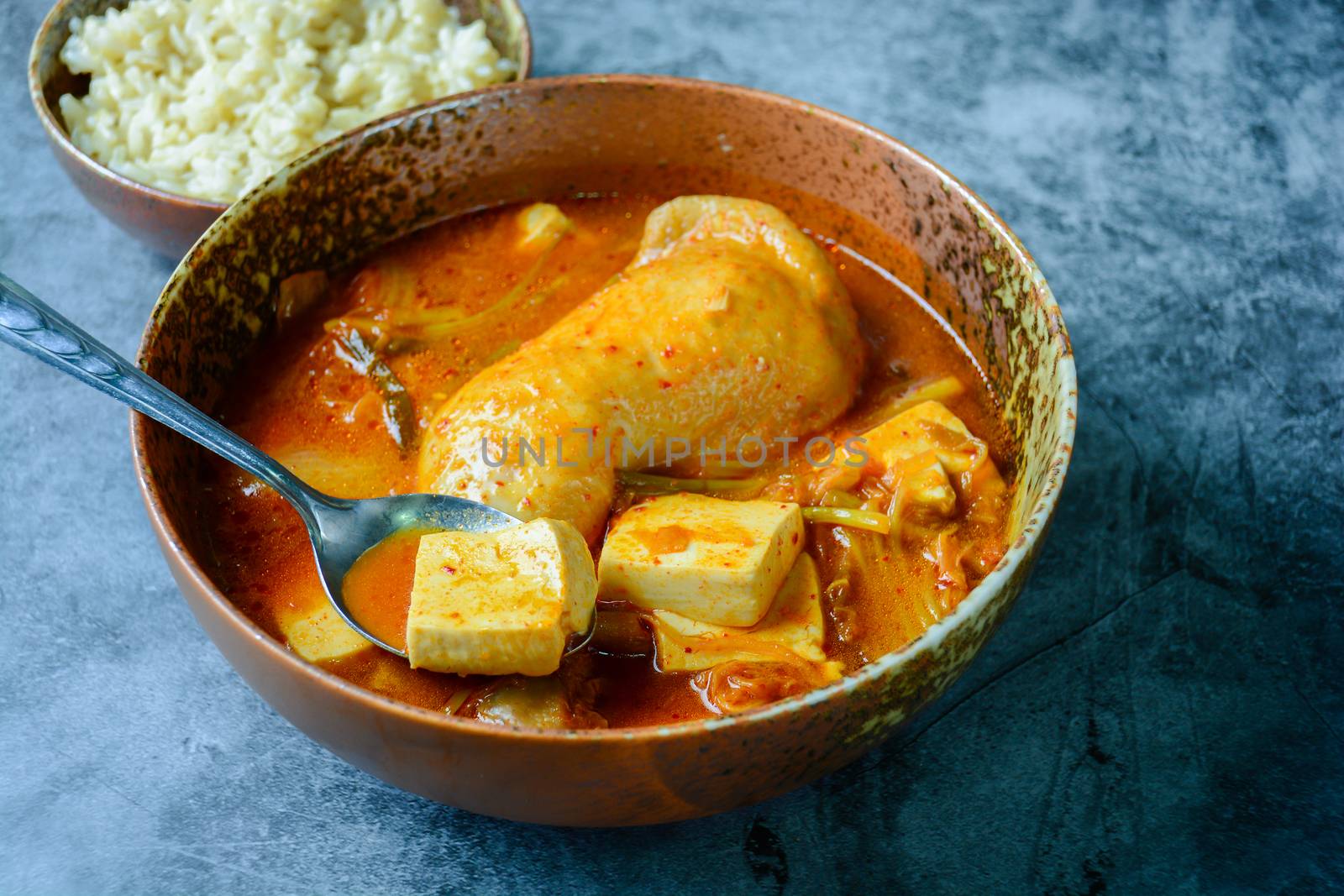 Korean traditional Kimchi soup with chicken and soft tofu by yuiyuize