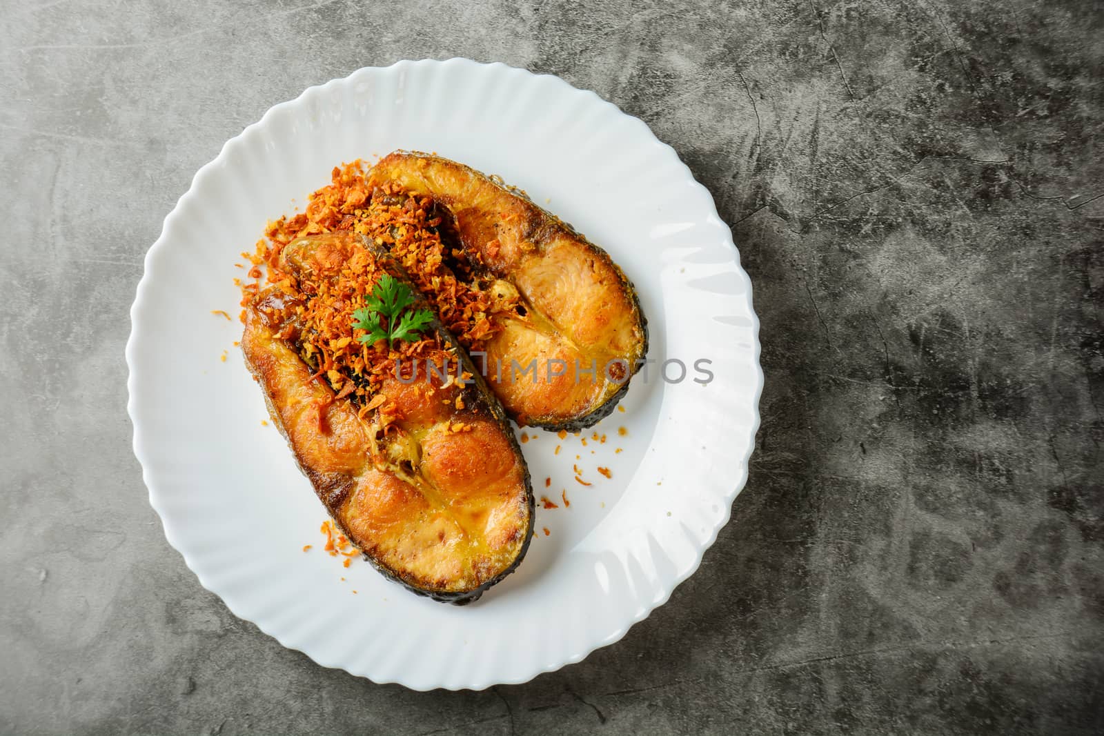 Deep Fried Pangasius fish with Black Pepper Garlic and fish source, quick and easy dish.
