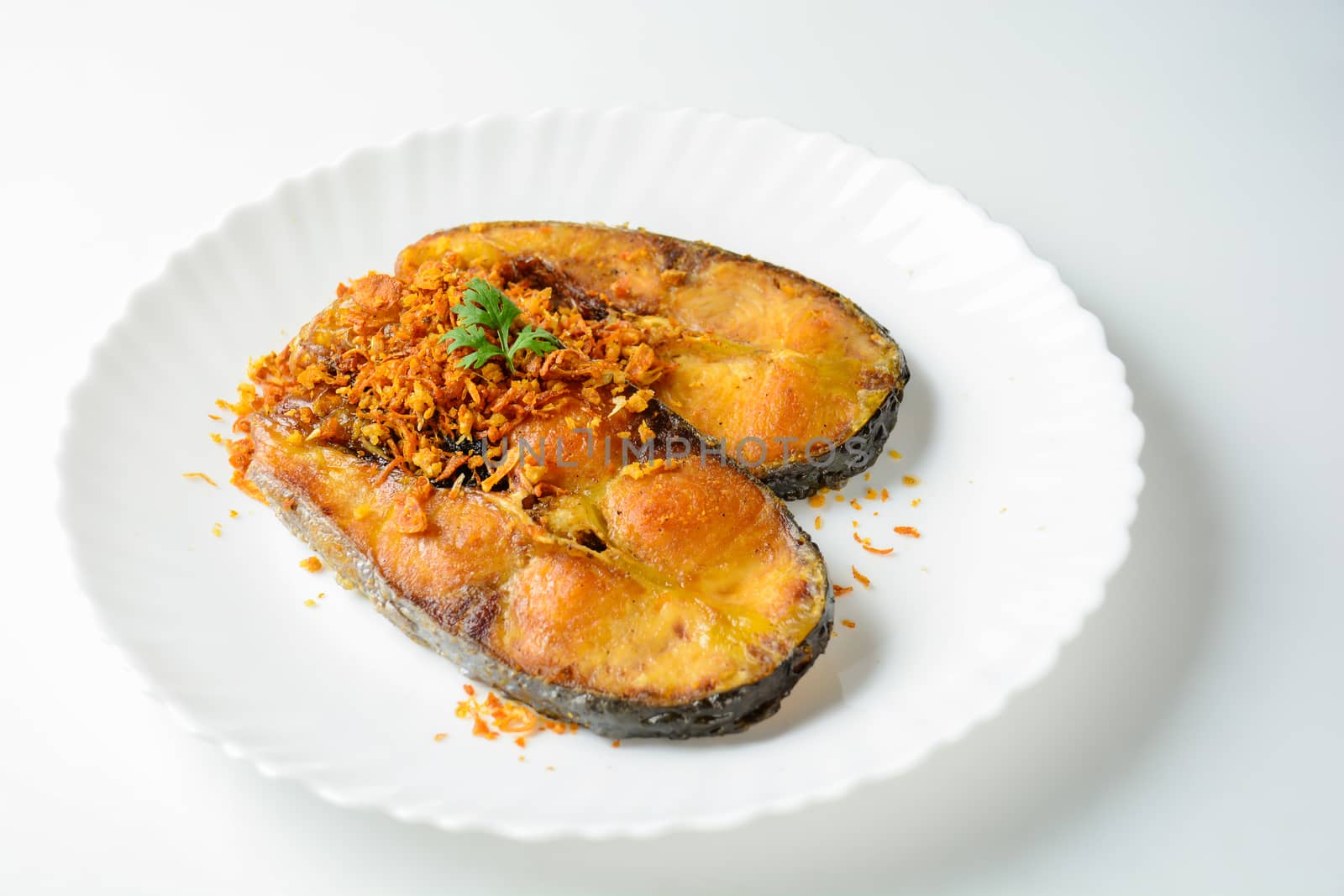 Deep Fried Pangasius fish with Black Pepper Garlic and fish source, quick and easy dish.
