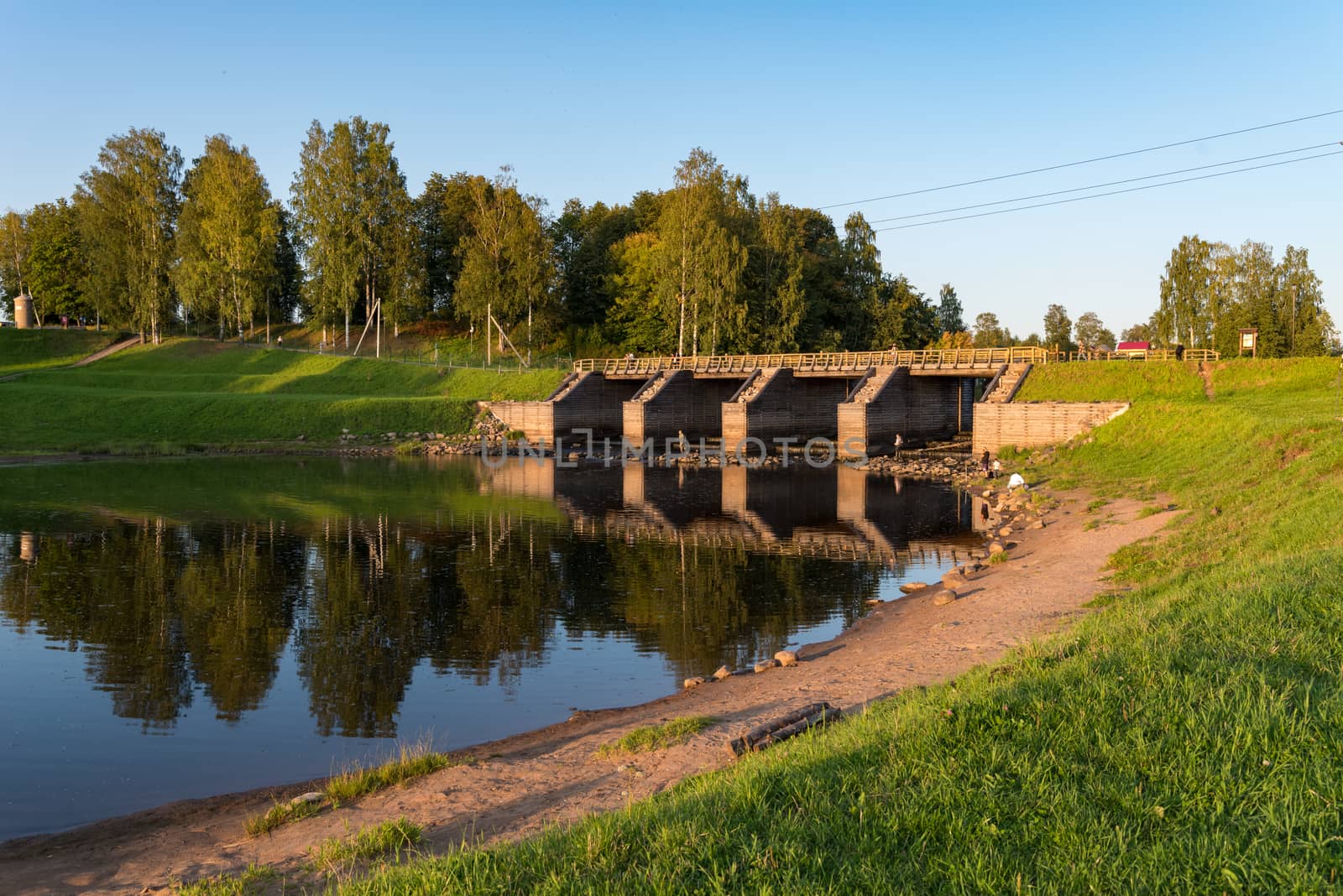 Newly restored elements of historical Tikhvin water system - wooden sluice. One of the landmark of Tikhvin, Russia