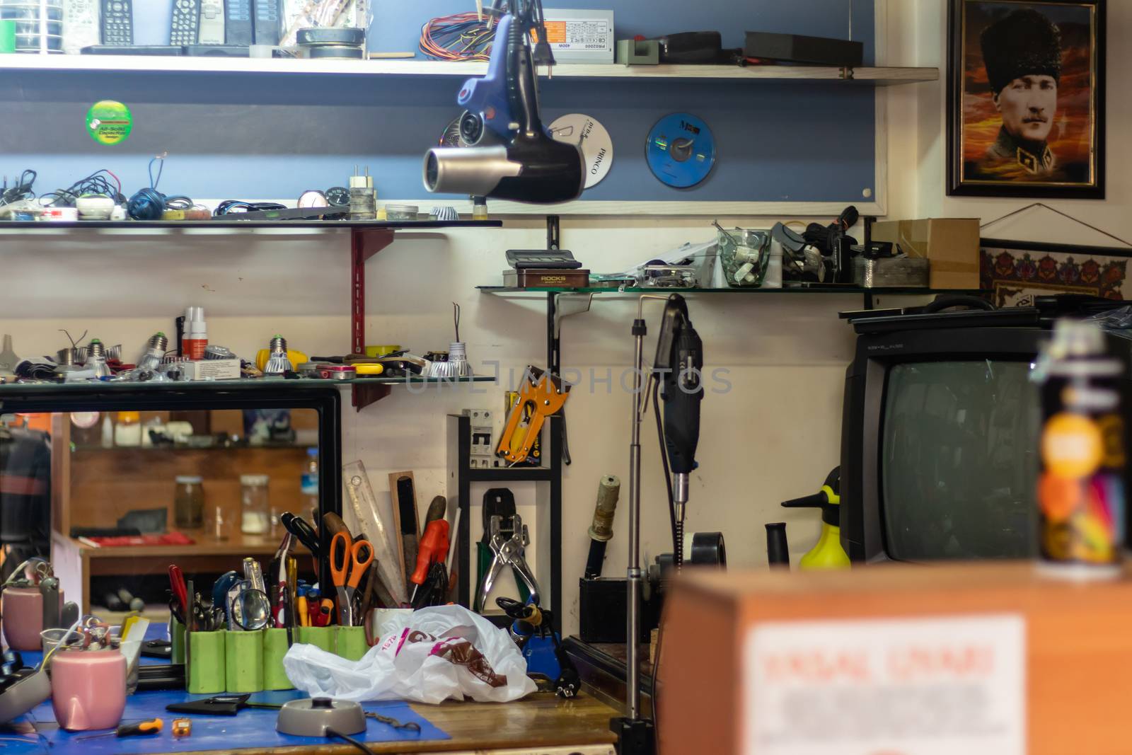 a wide shoot vintage tinker shop with many tools and blur on foreground. photo has taken at izmir/turkey.