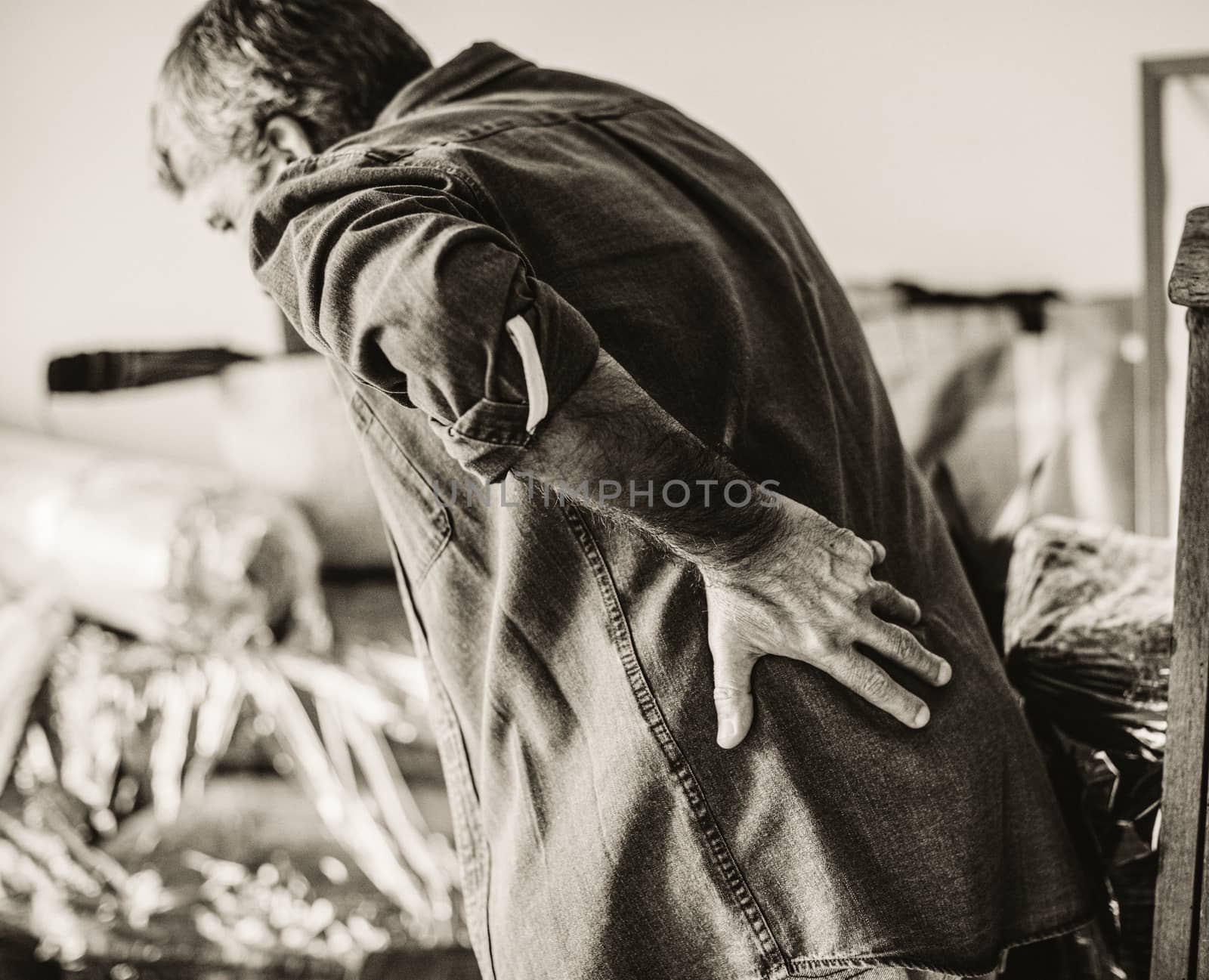 Senior man suffering from chronic back ache