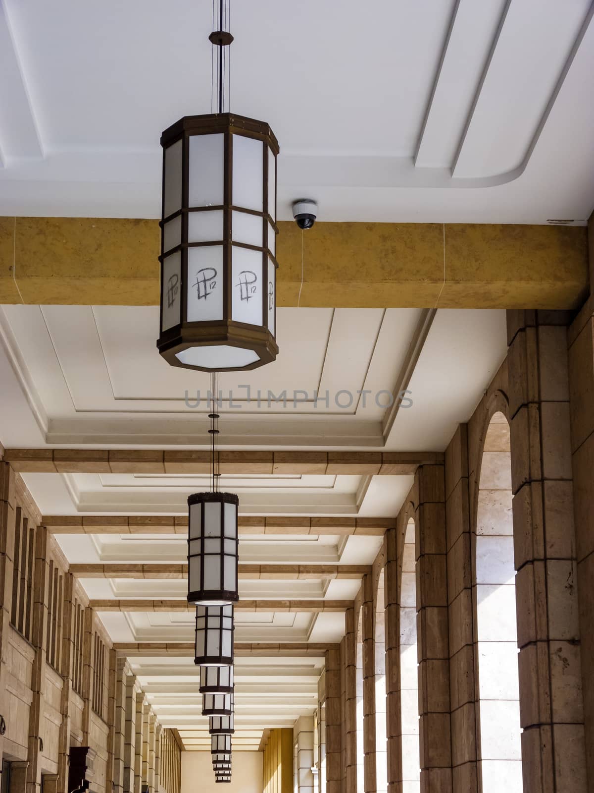 Many round lamps on top of a roof.