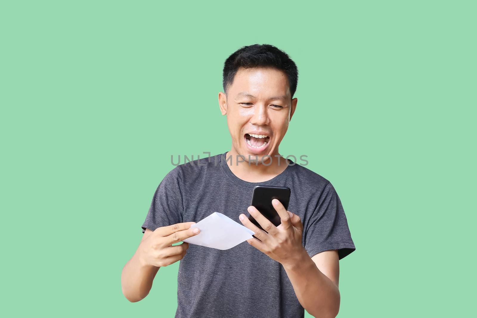 young man holding blank card by aekgasit