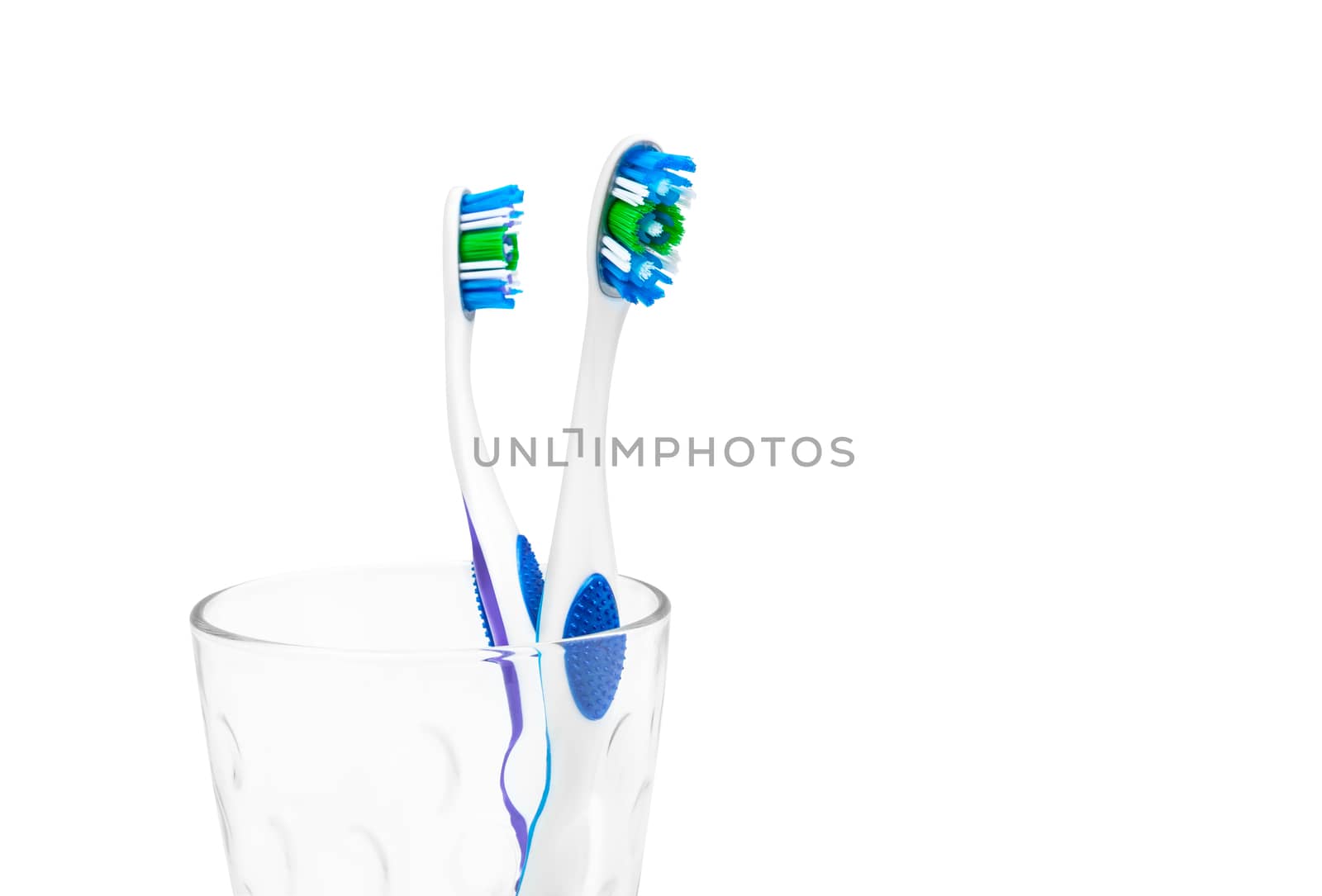 Toothbrushes in glass isolated on white background. With clipping path