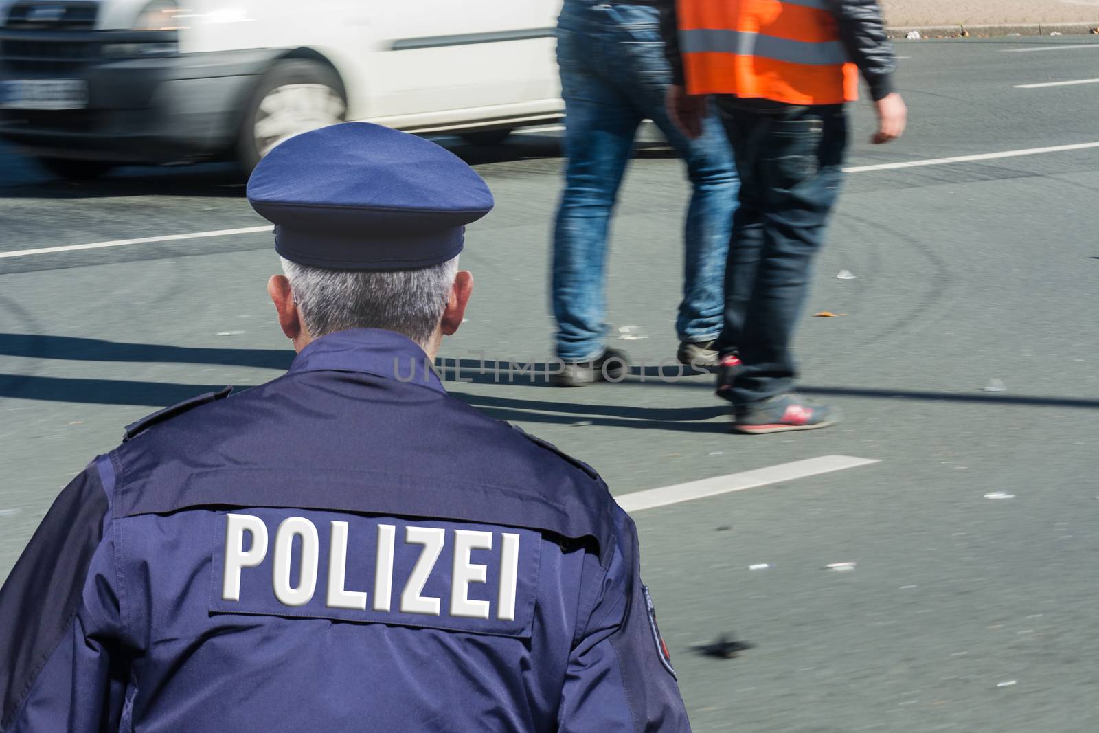 German police, locking and securing a crime scene.