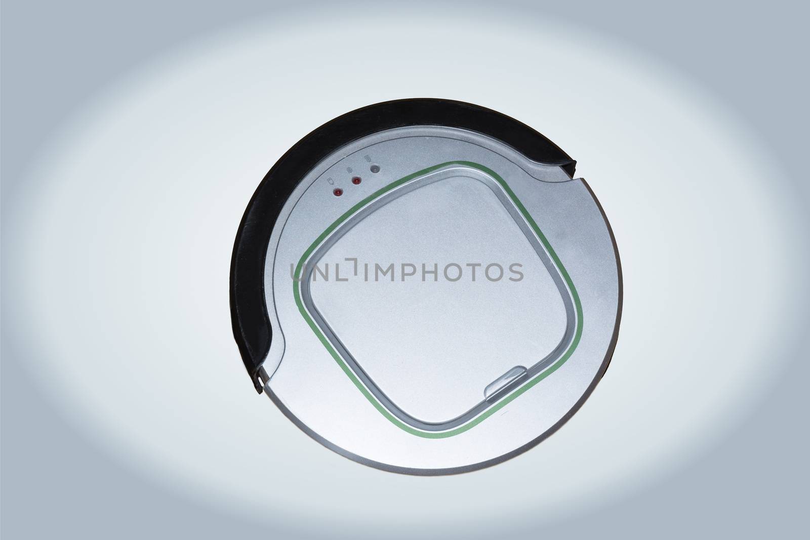 Robotic vacuum cleaner isolated on silver background
