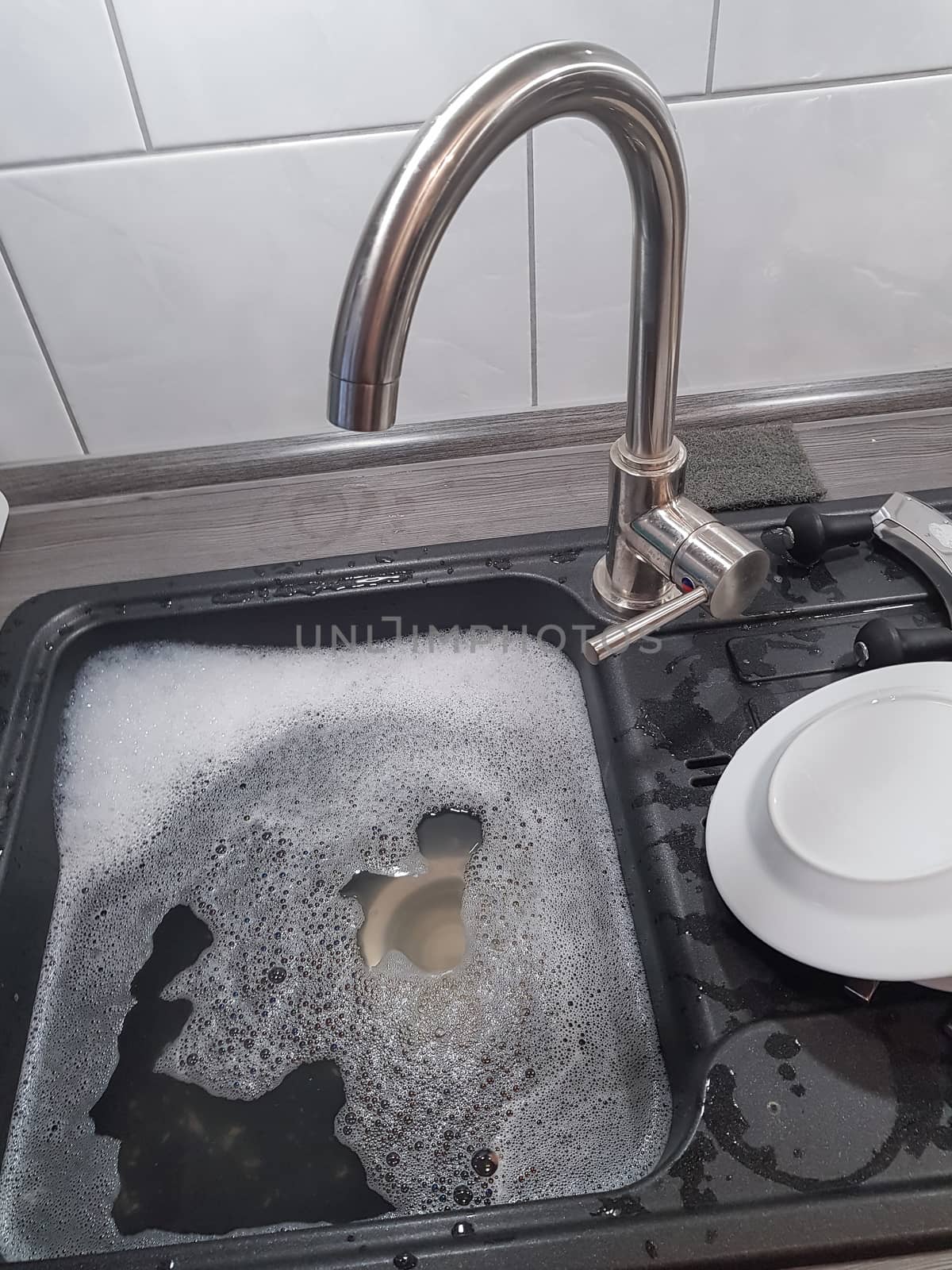 Wash and dry kitchen utensils on the sink by hand