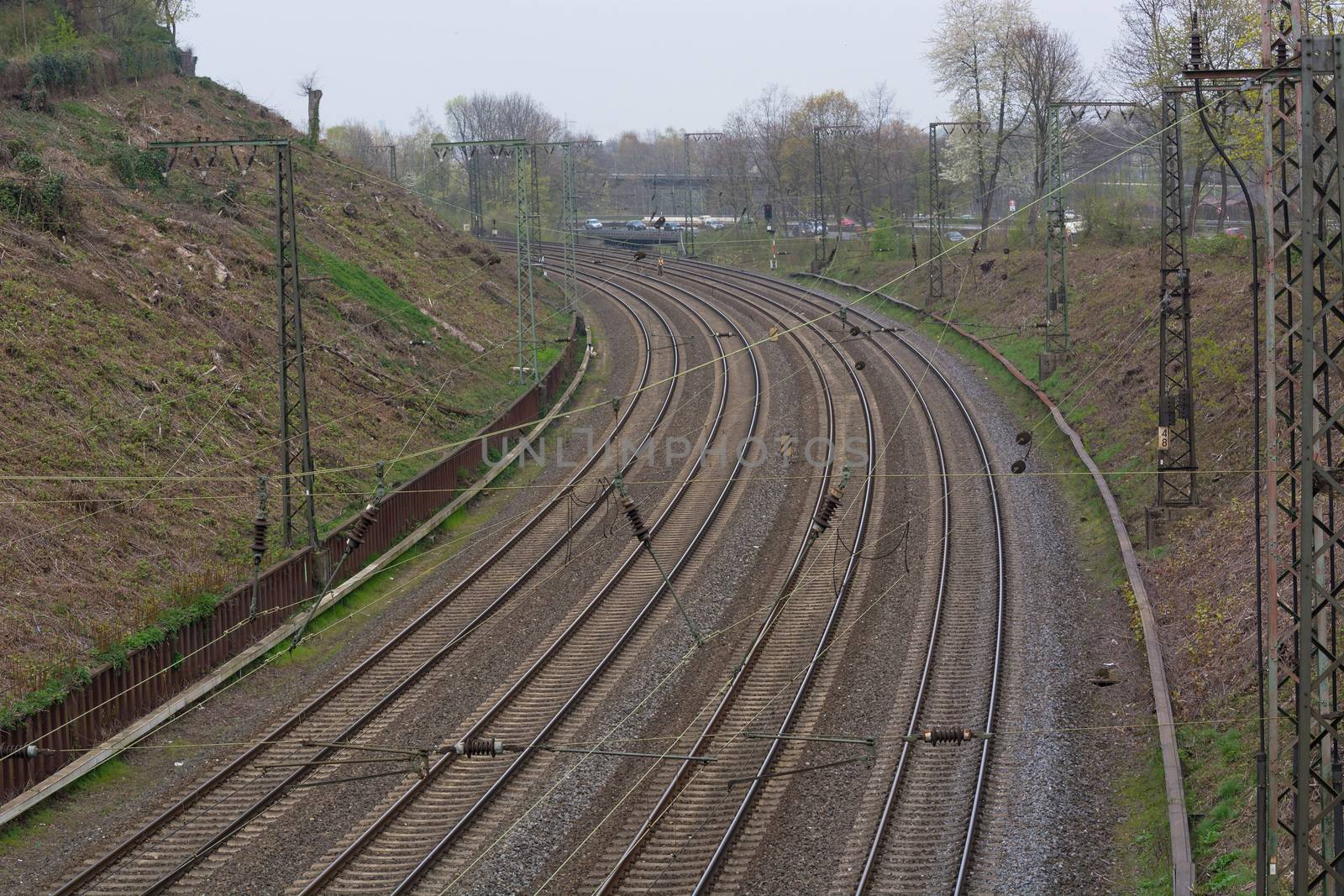 Railroad tracks at the train station             by JFsPic