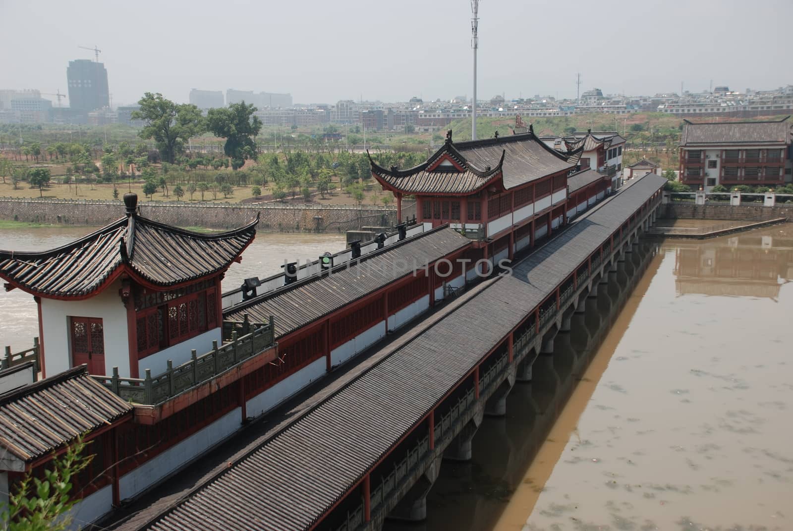 Old Chinese bridge with the roof