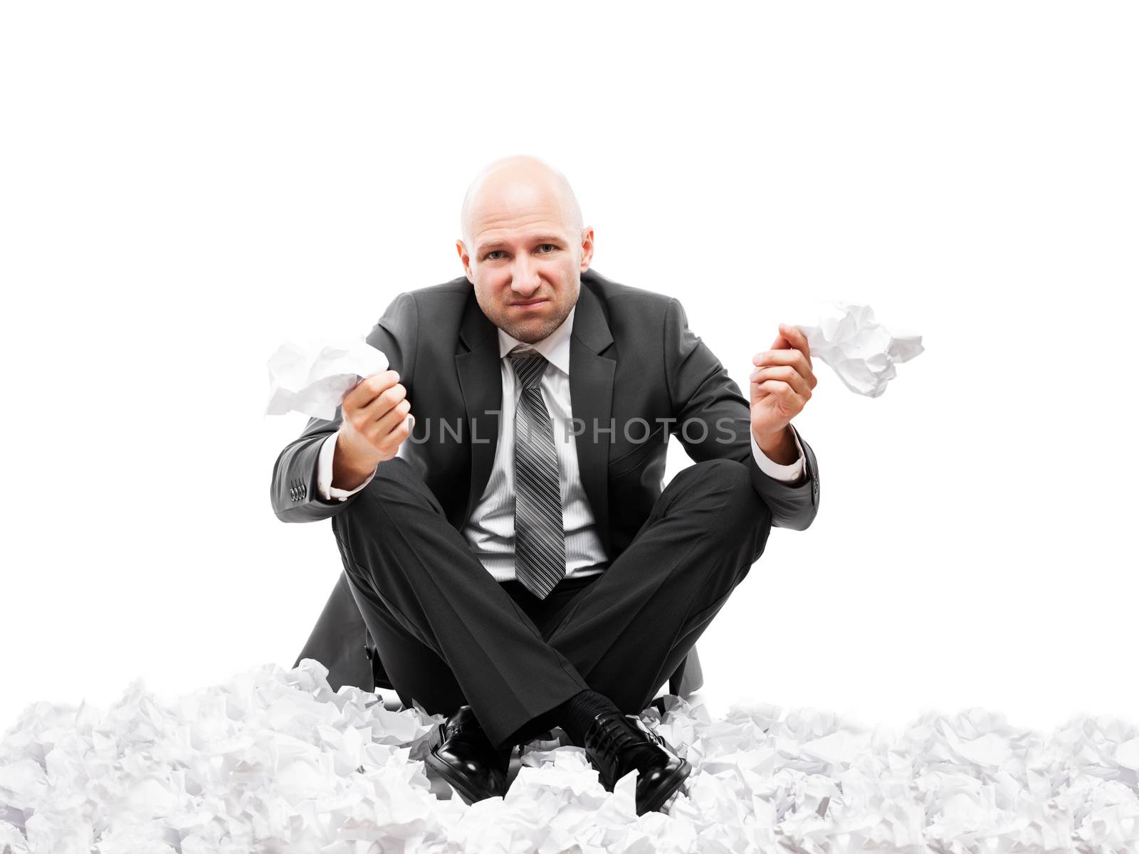 Angry businessman in depression hand holding crumpled torn paper document by ia_64