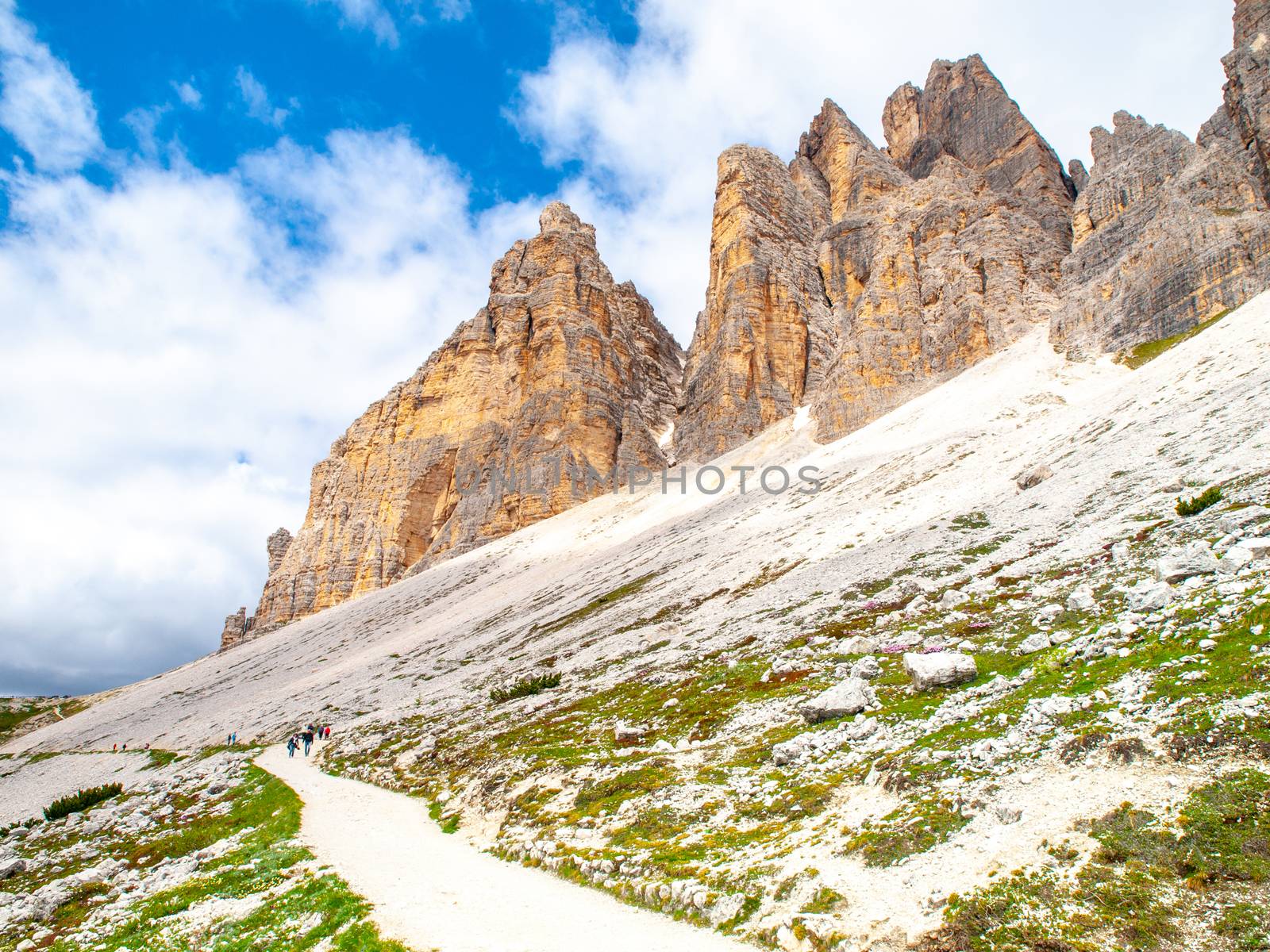 Tourist path under south face of Tre Cime di Lavaredo, Dolomites, Italy.