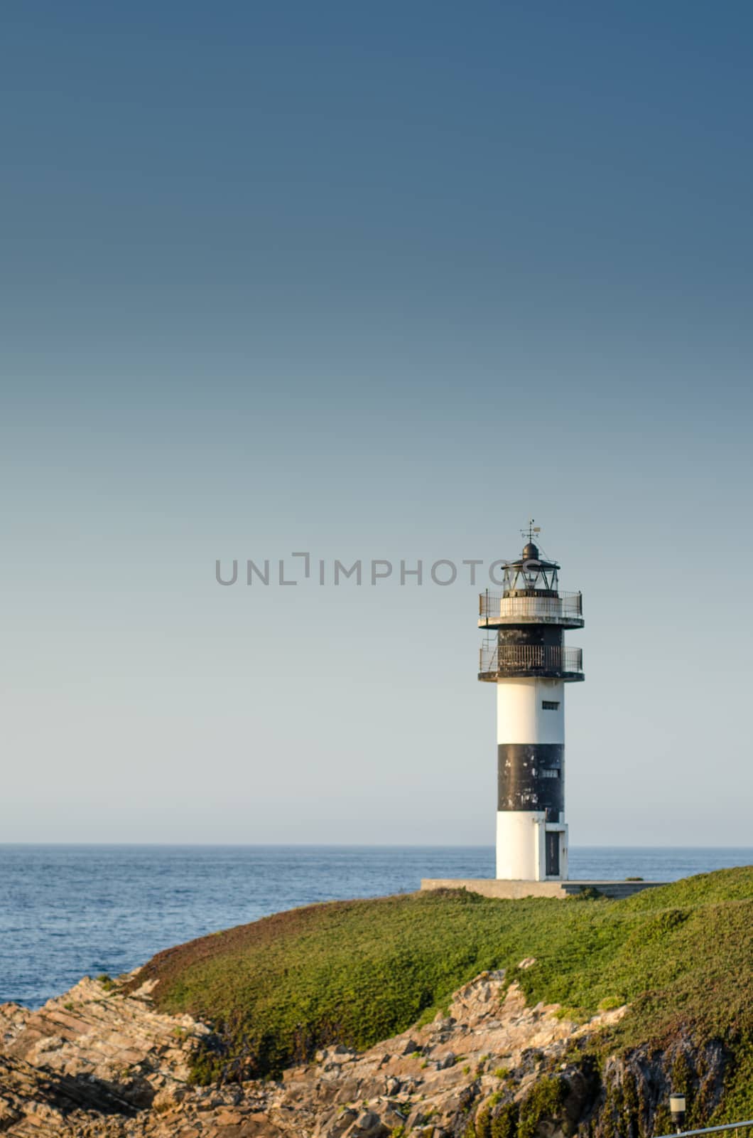 Lighthouse in a shiny day by mikelju