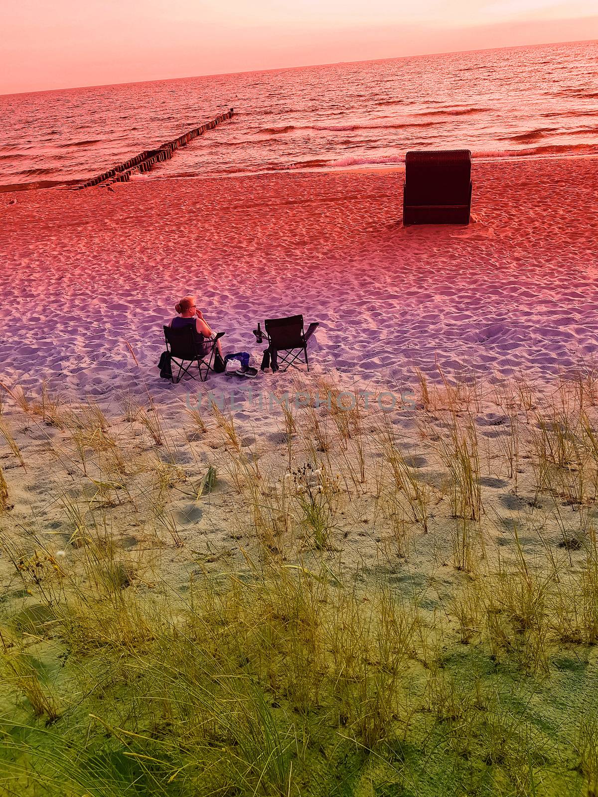 Rear view of a woman on the beach       by JFsPic