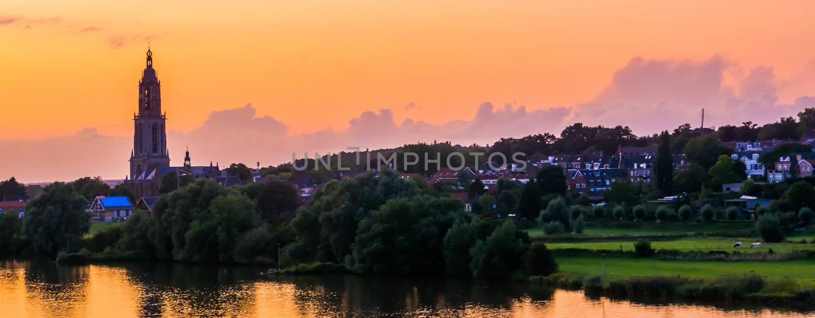 beautiful city skyline of Rhenen during sunset, beautiful rustic town with water, The netherlands by charlottebleijenberg