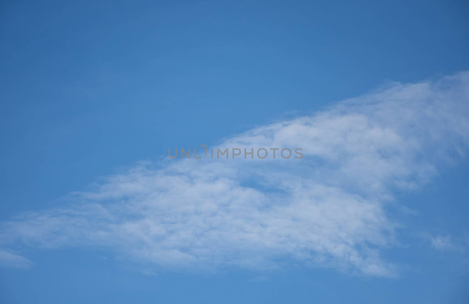 blue sky background with tiny clouds. by anuraksir