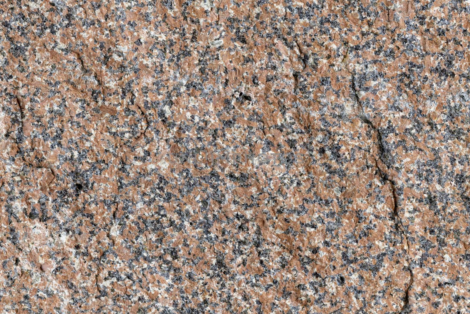 Granite in a brown-black shade as full-screen background picture
