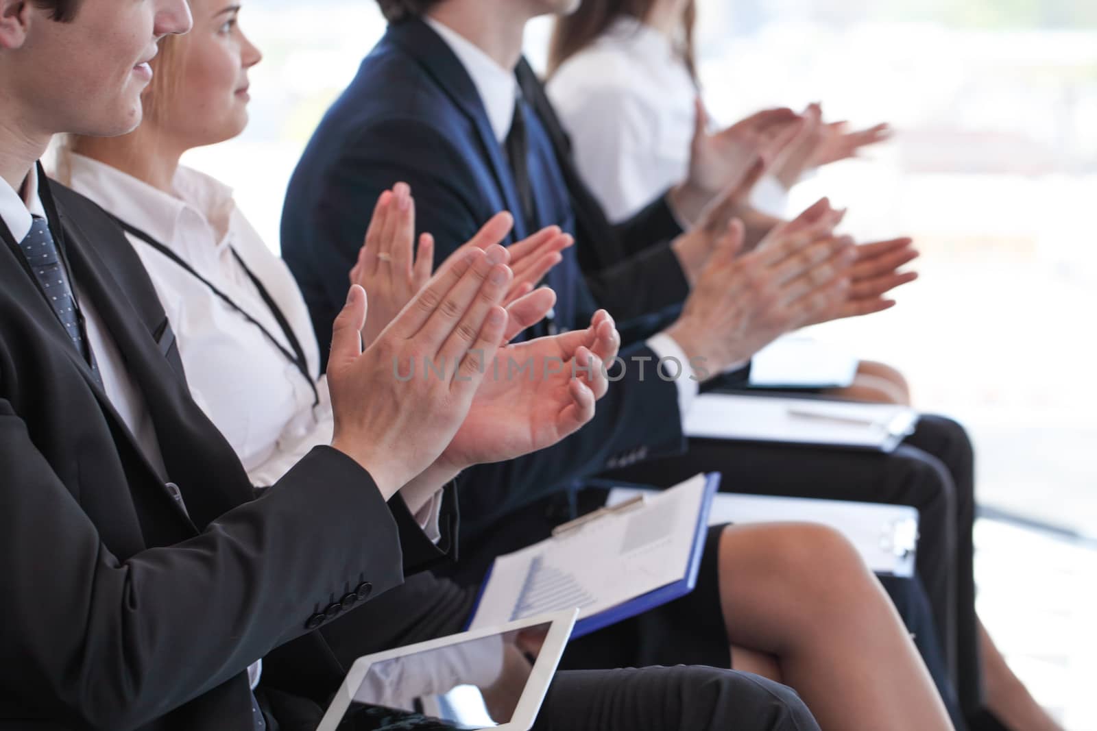 Photo of business partners hands applauding at meeting