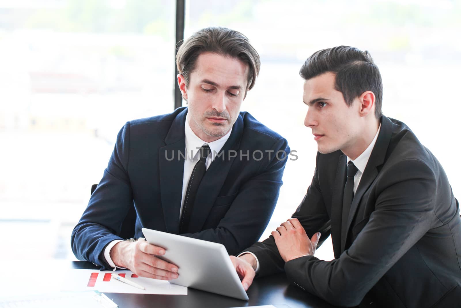 Two colleagues with tablet by ALotOfPeople